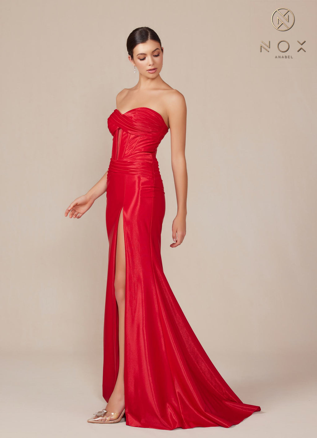 Red strapless fitted evening gown with ruched bodice and high side slit