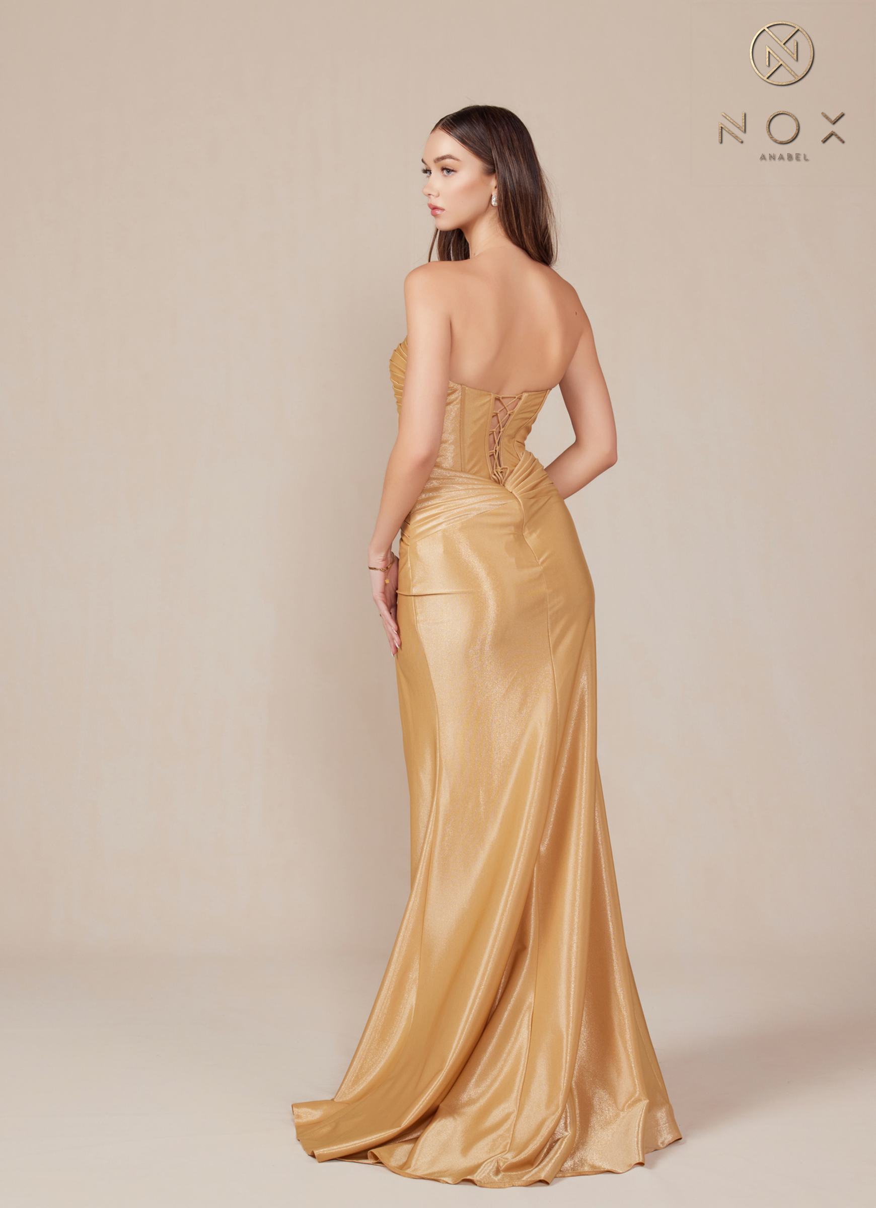 Gold strapless fitted evening gown with ruched corset bodice and high side slit, side view