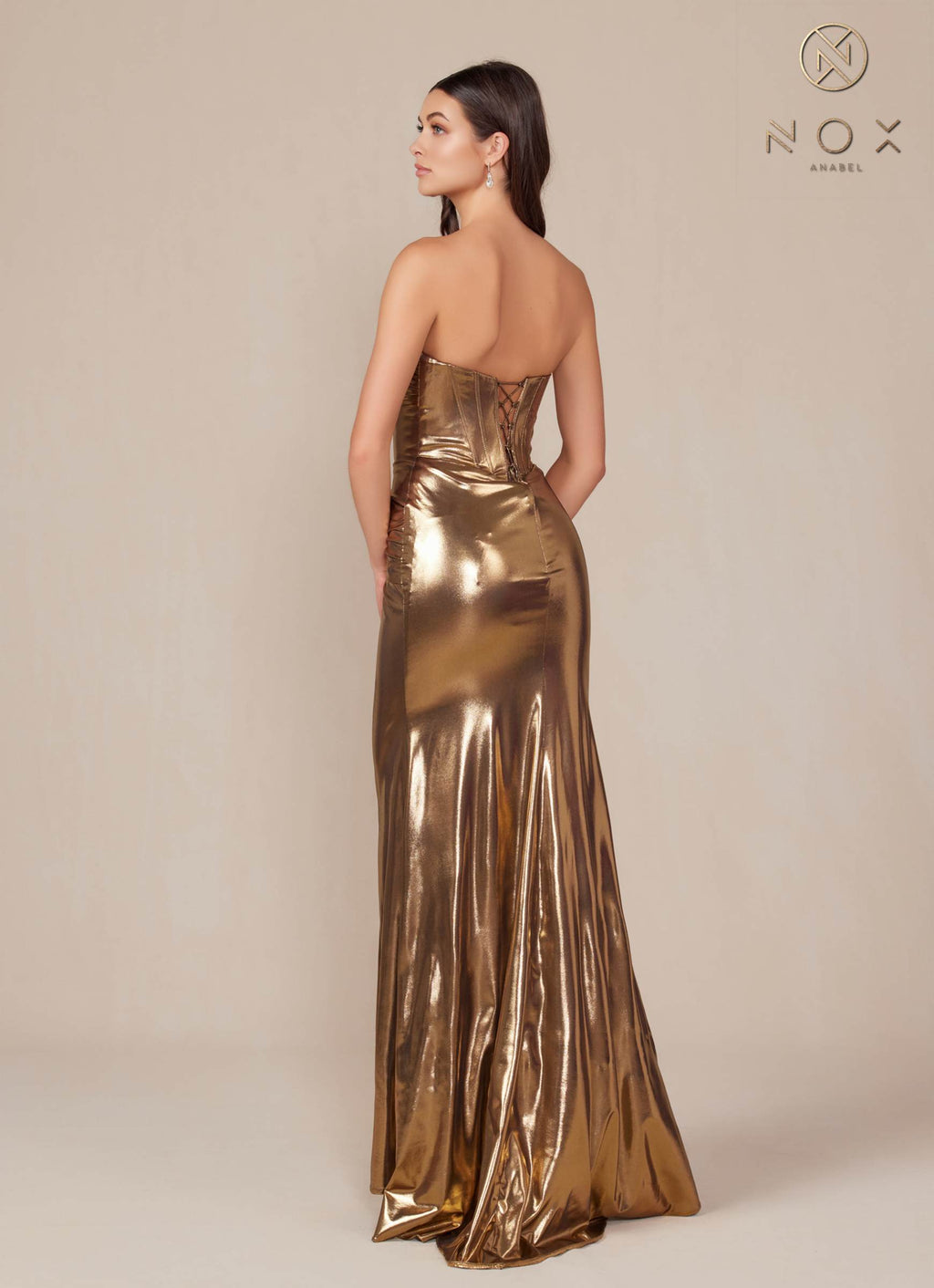 Gold strapless metallic satin fitted gown with open back and draped ruched bodice