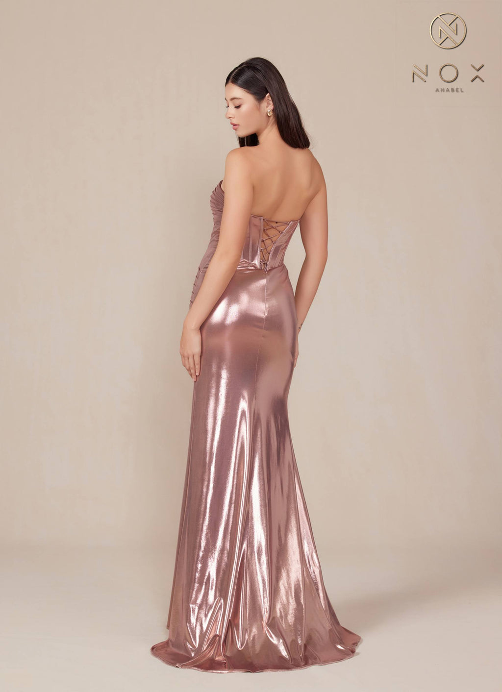 Rosegold metallic satin strapless fitted gown, back view with ruched detailing