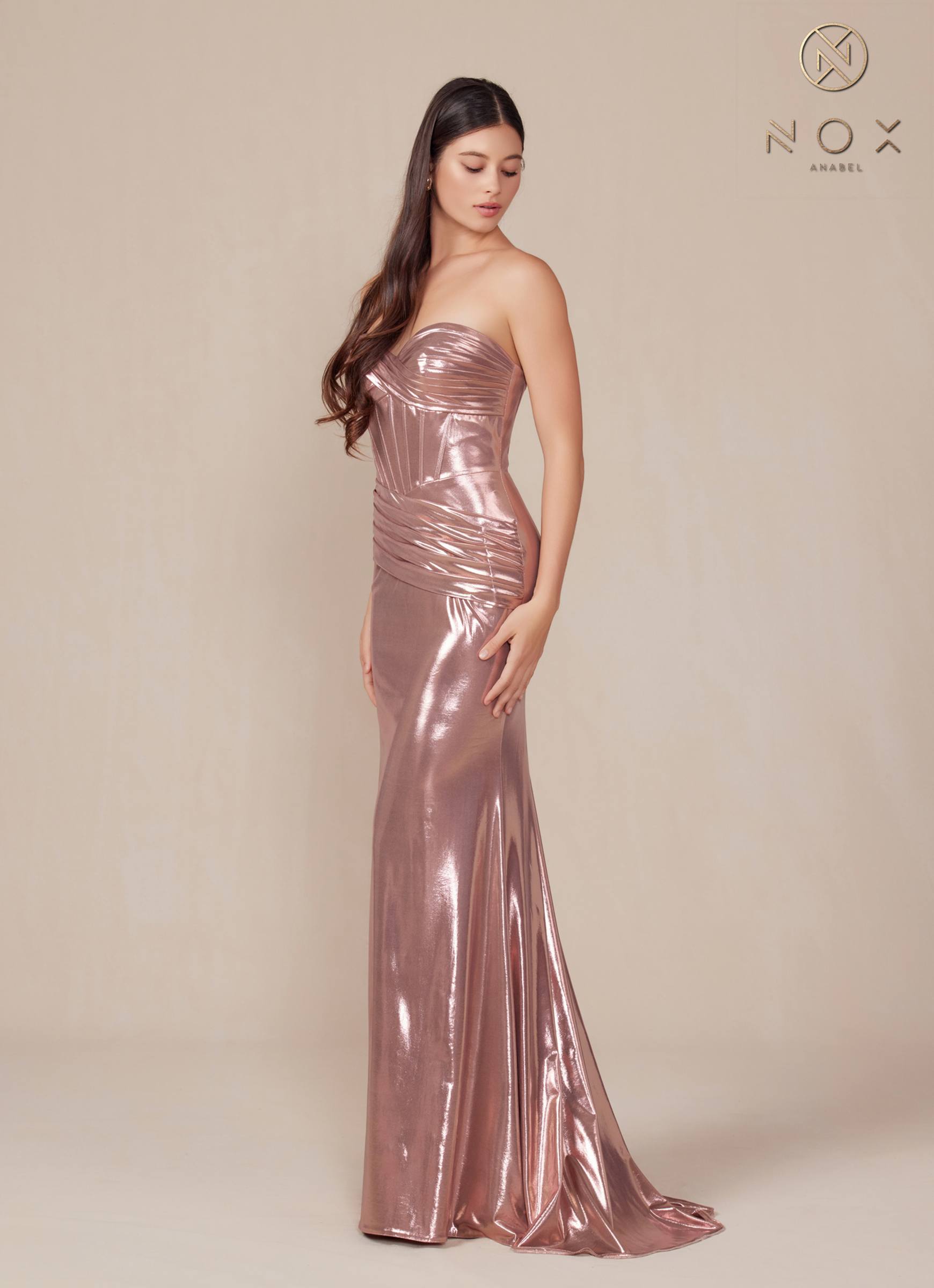 Rosegold metallic satin strapless fitted gown with ruched seams and long hem