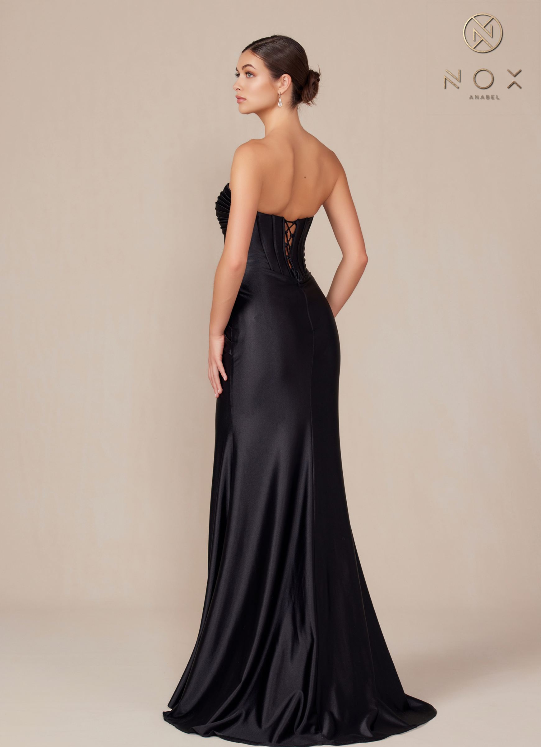 Satin strapless floor-length dress in black, back view with ruched corset detailing