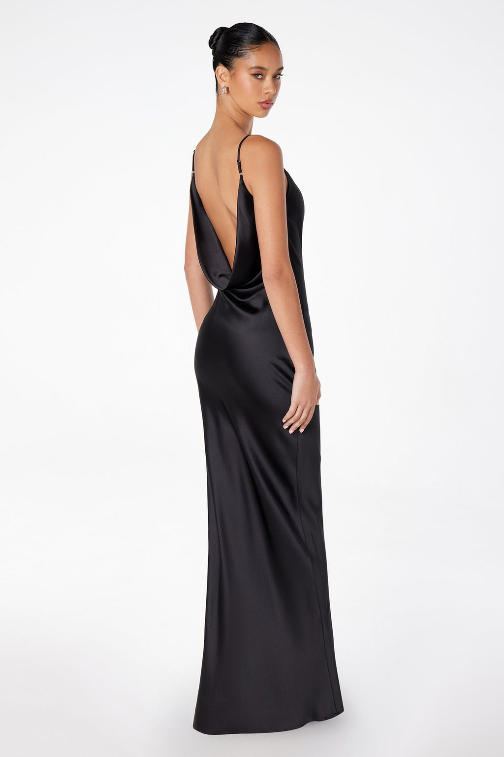 Sleeveless open-back satin gown in dark black, low back and long column silhouette.