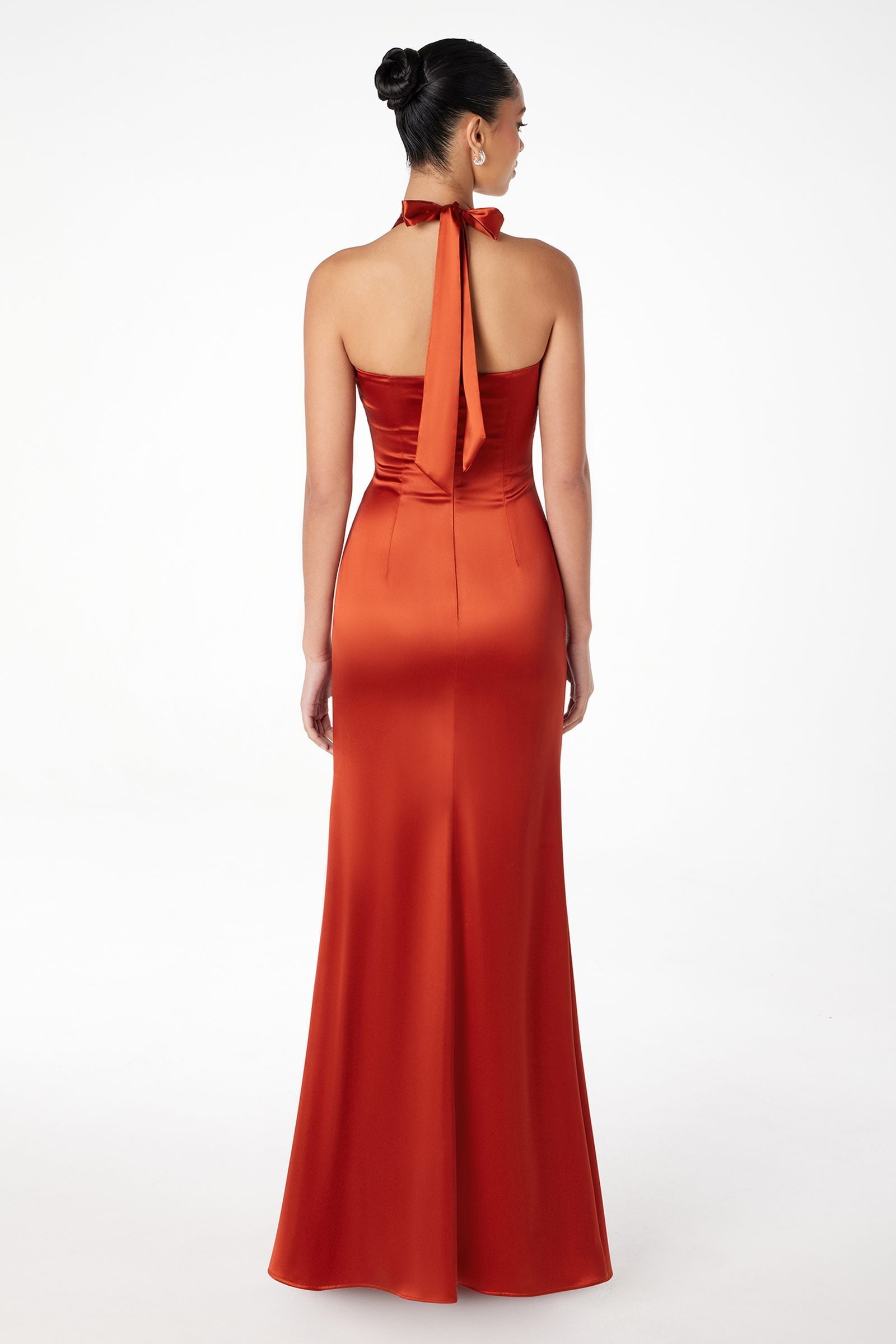 Red satin halter gown with open back and draped strap detail, long fitted skirt