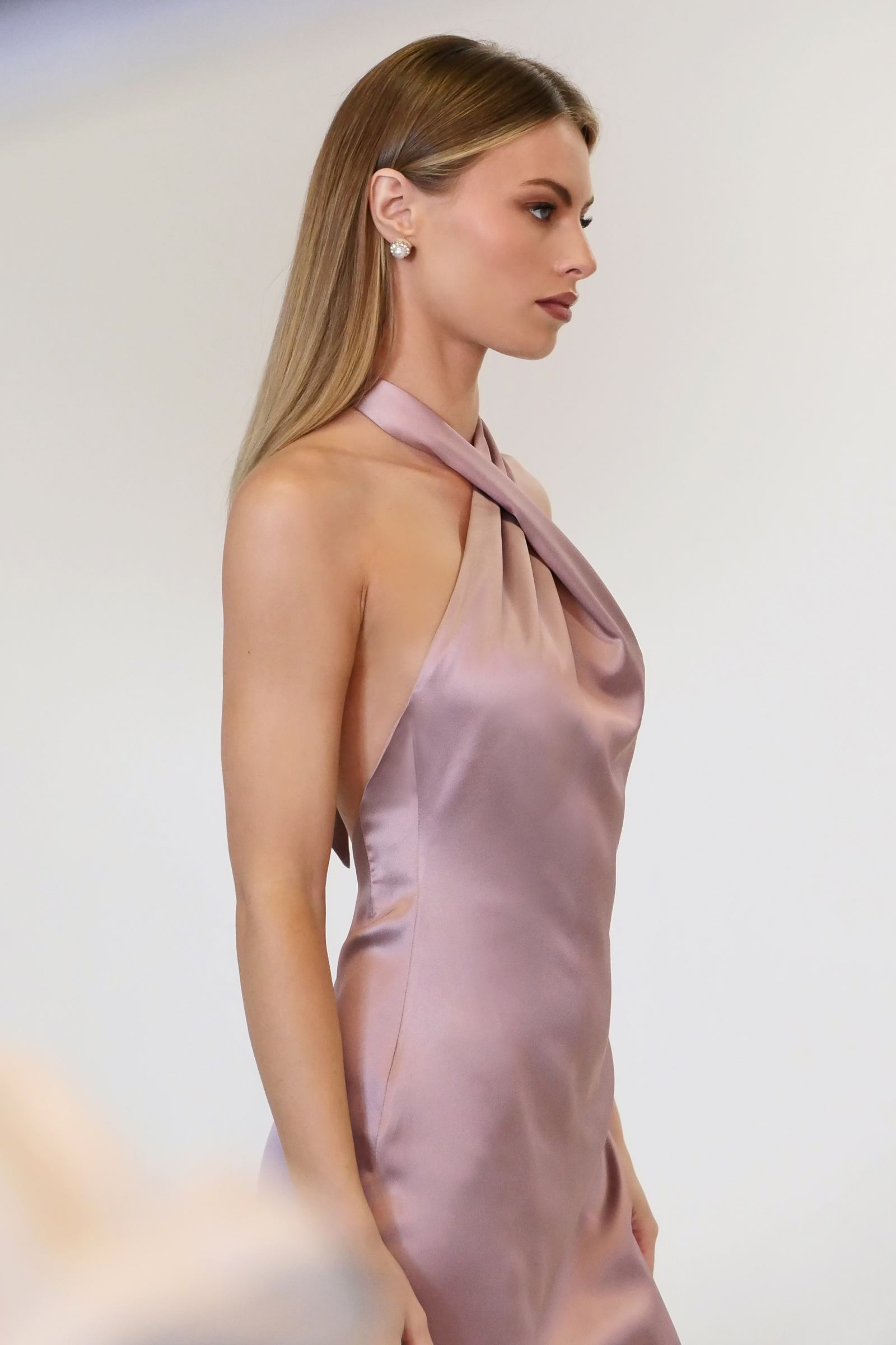 Satin halter mermaid gown in mauve, twisted draped halter neckline and fitted bodice