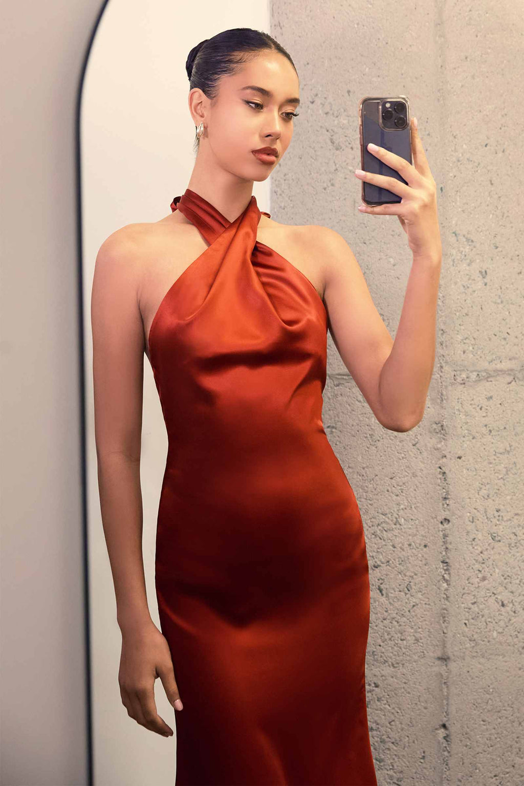 Satin halter mermaid gown with twisted neck, fitted ruched silhouette, sleeveless