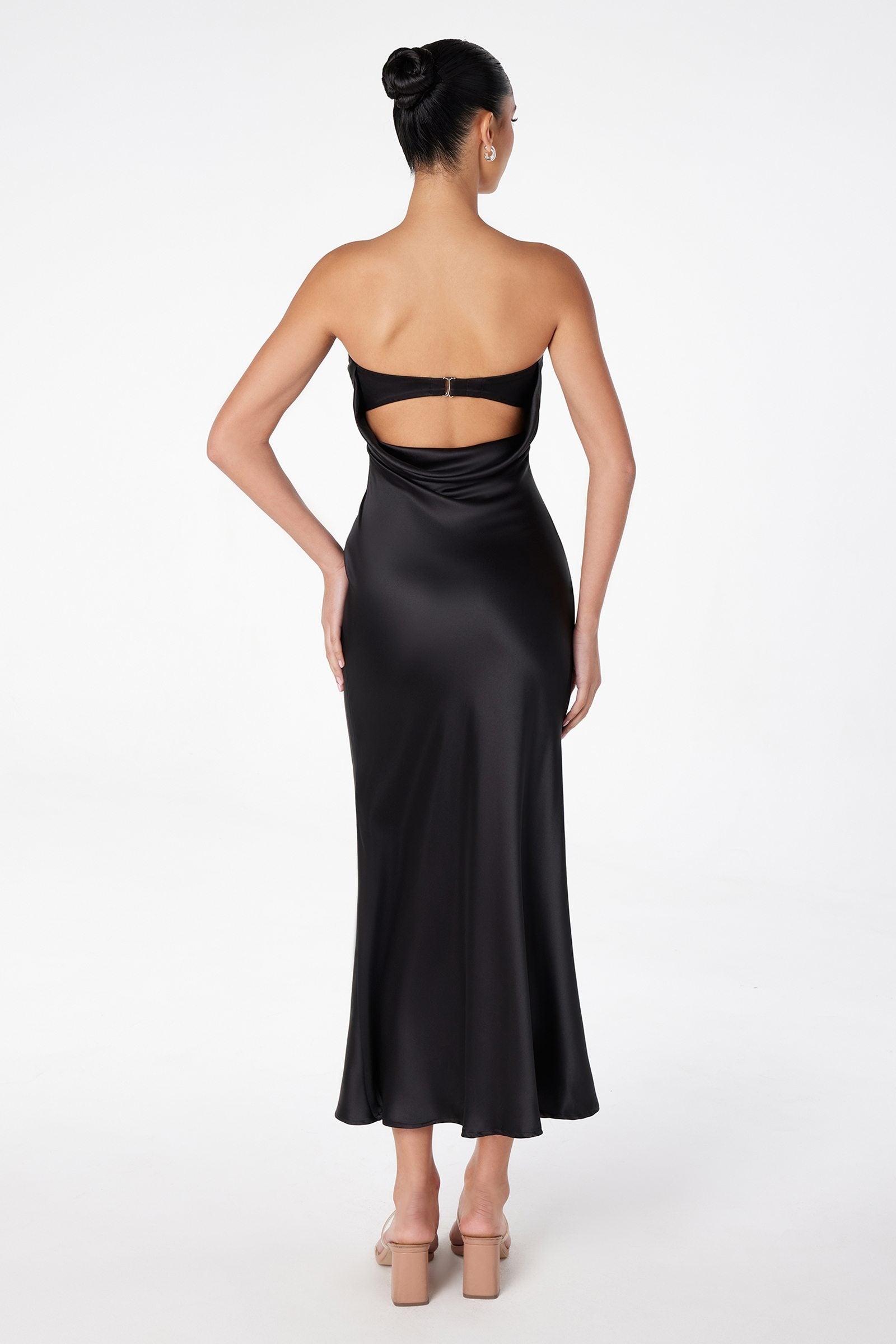 Black satin tea-length dress with strapless front and open back cutout