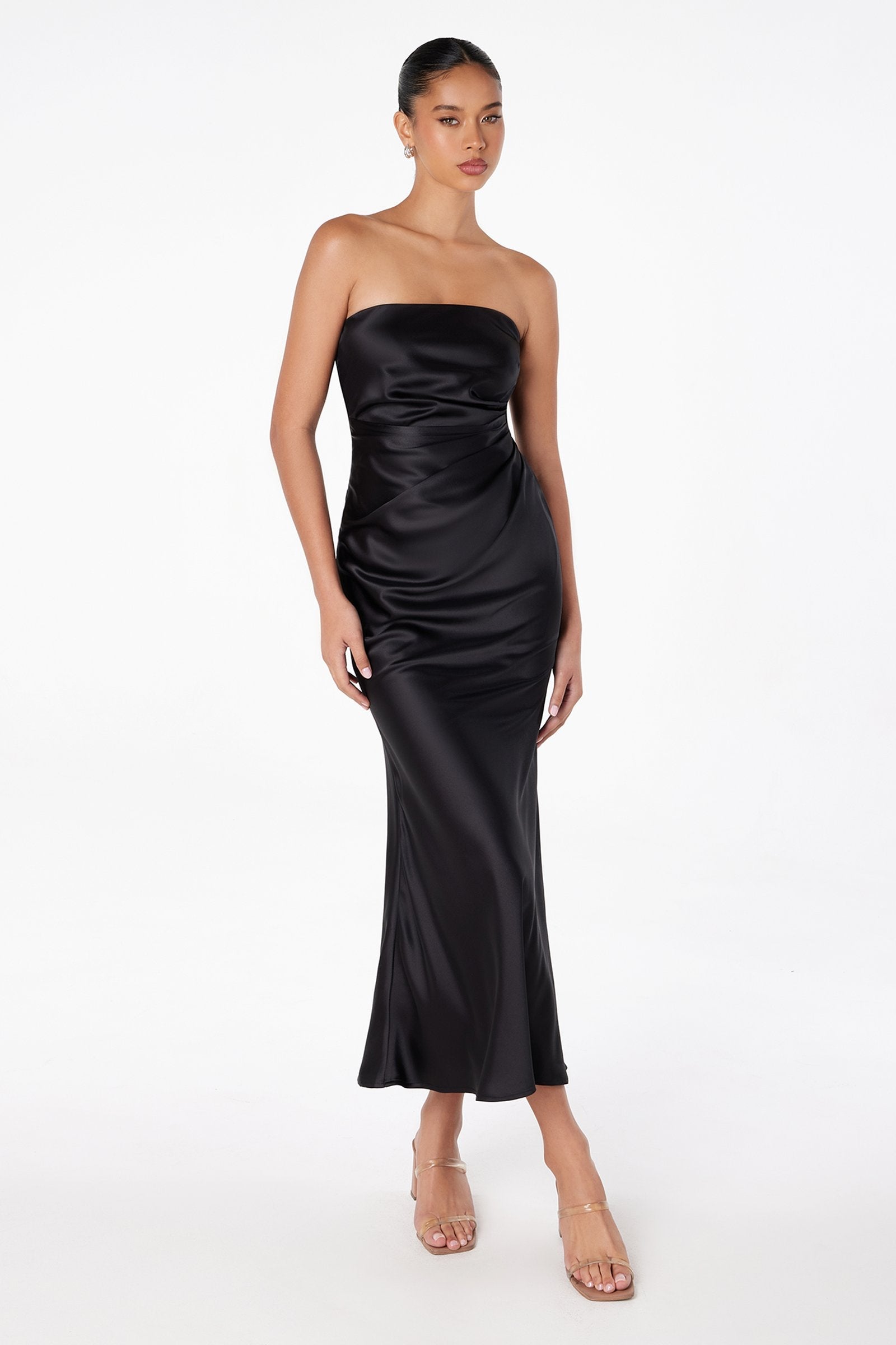 Black satin tea-length strapless dress with ruched bodice and fitted skirt