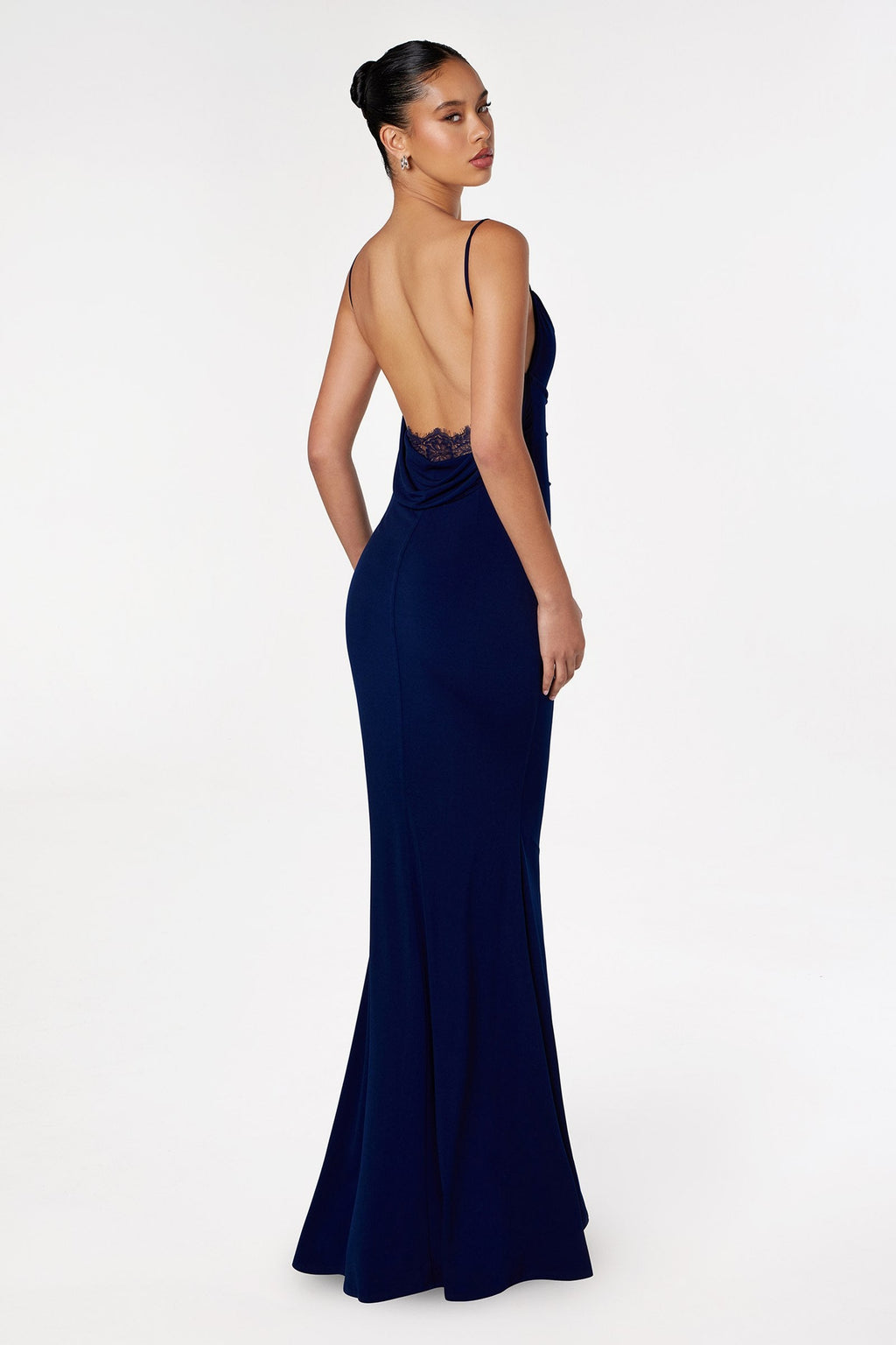 Navy blue fitted spaghetti-strap gown with lace-covered open back and mermaid hem