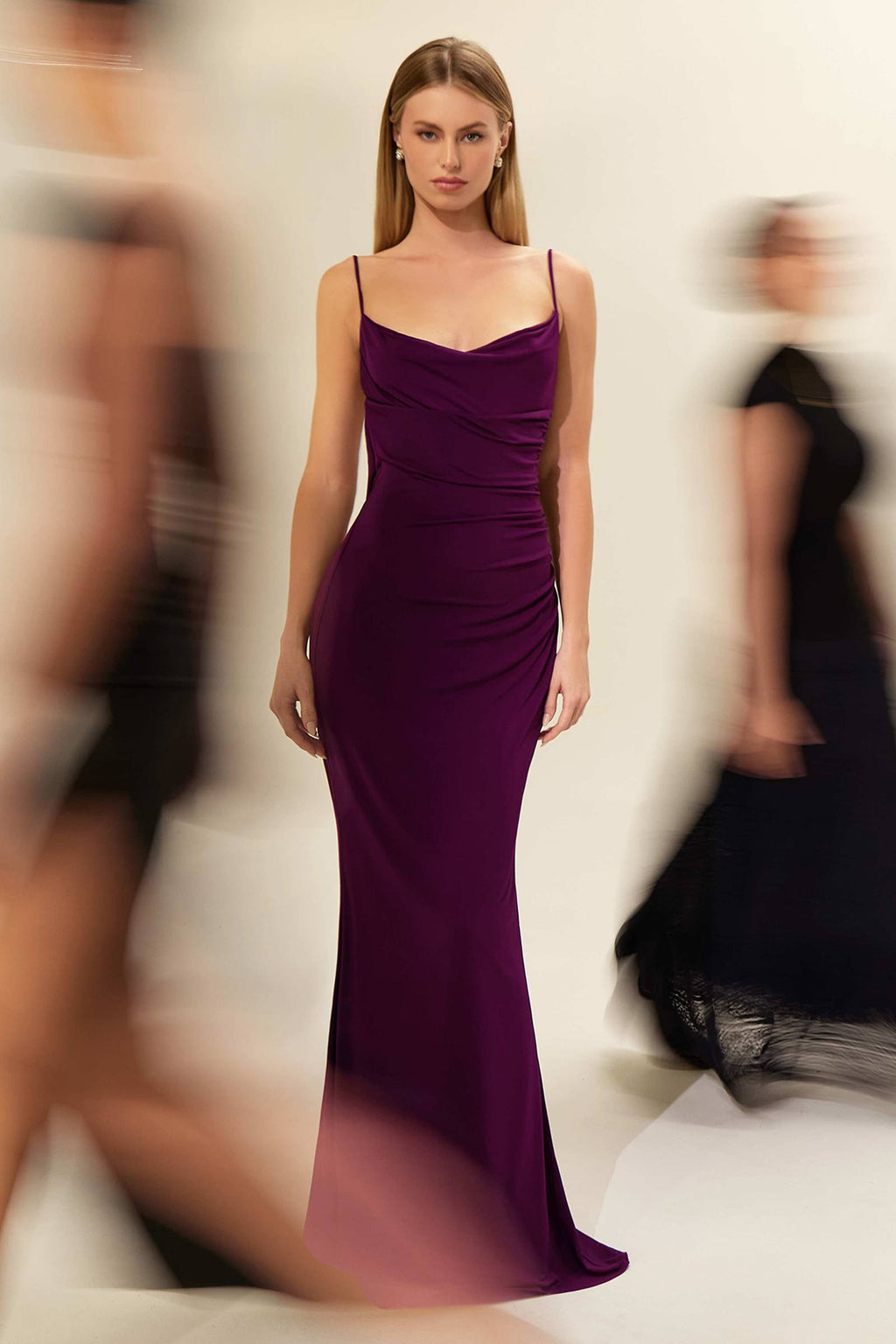Fitted spaghetti strap gown with V-neckline and ruched bodice; fitted long mermaid silhouette.