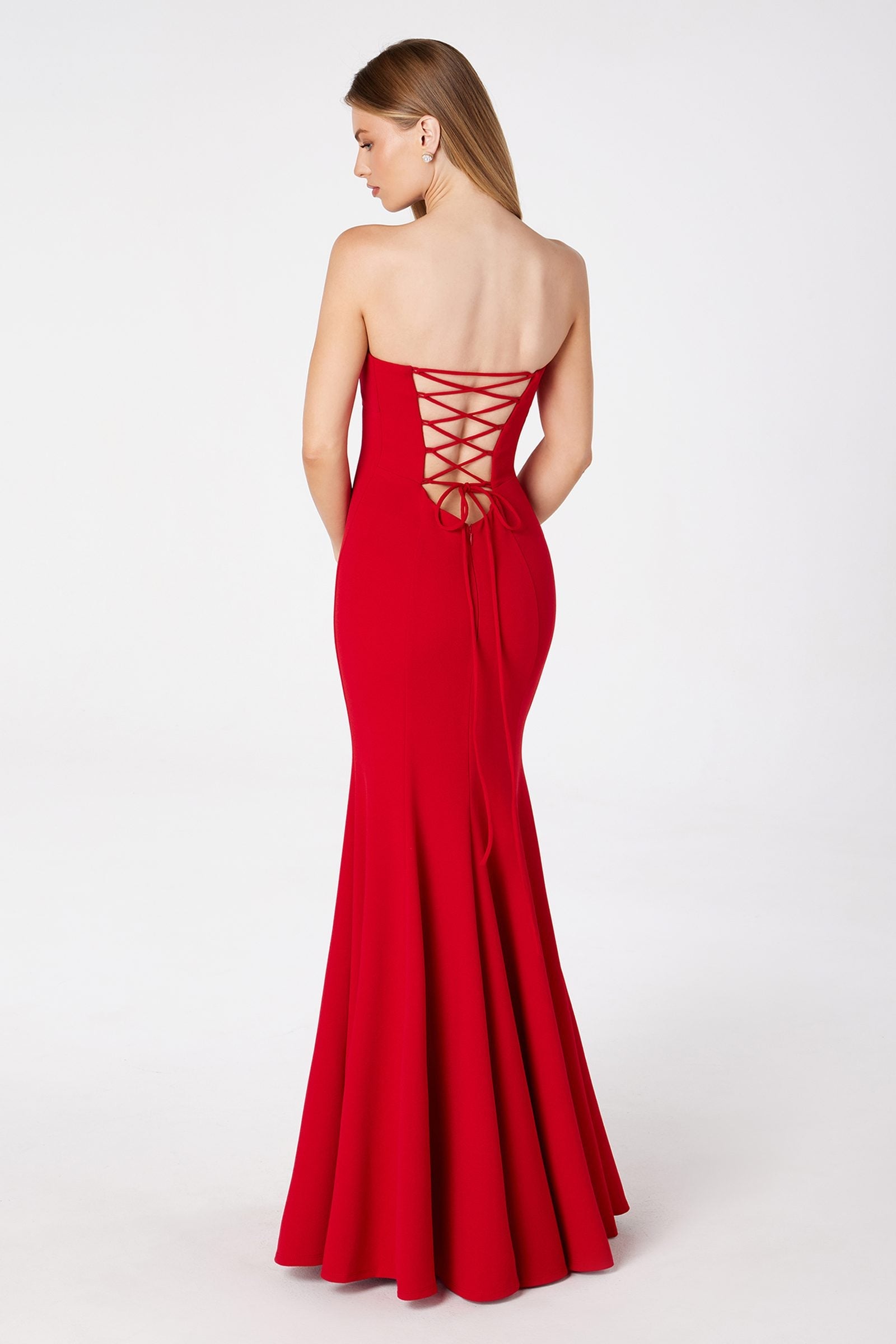 Red strapless gown with crisscross lace-up open back and flared mermaid skirt