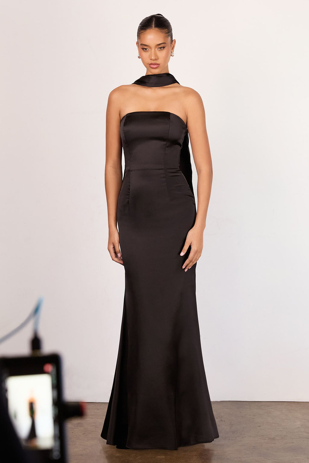Strapless fitted mermaid gown in black satin with a smooth fitted silhouette