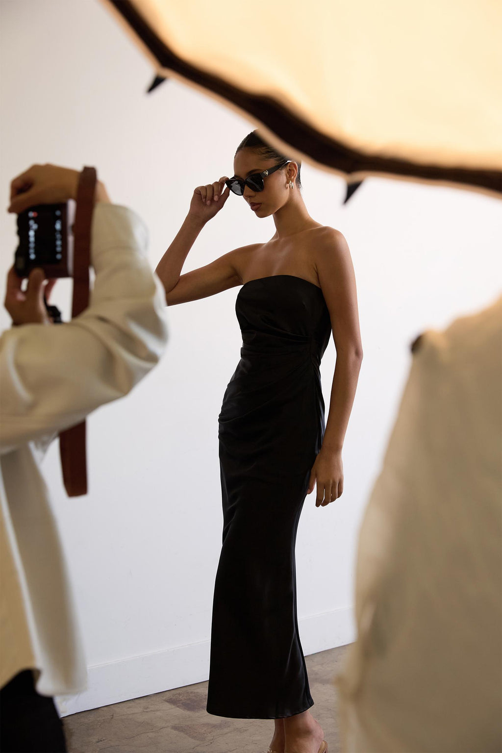 Strapless fitted mermaid gown in black satin with a strapless neckline