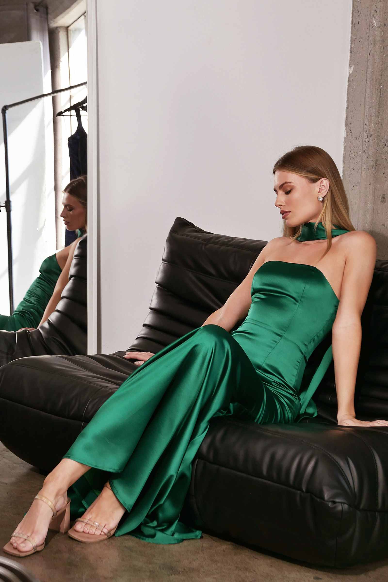 Emerald green strapless fitted mermaid gown with flowing scarf at the back