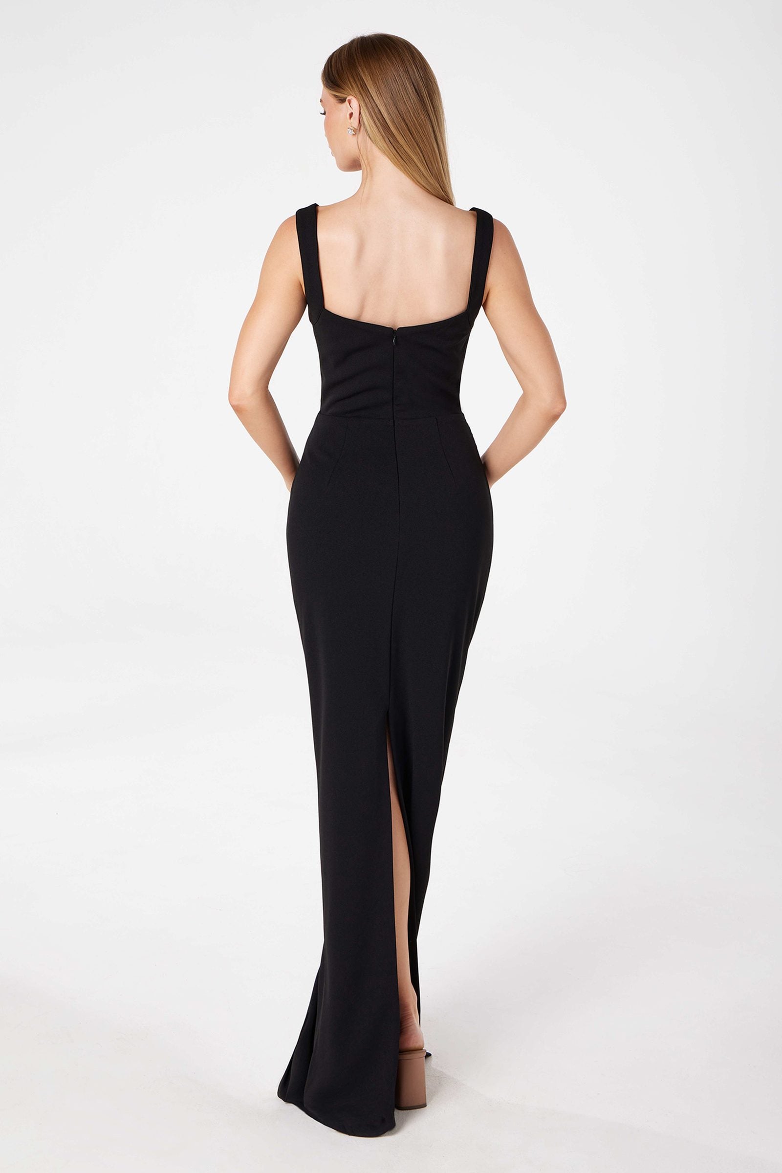 Black fitted gown with open back and back leg slit