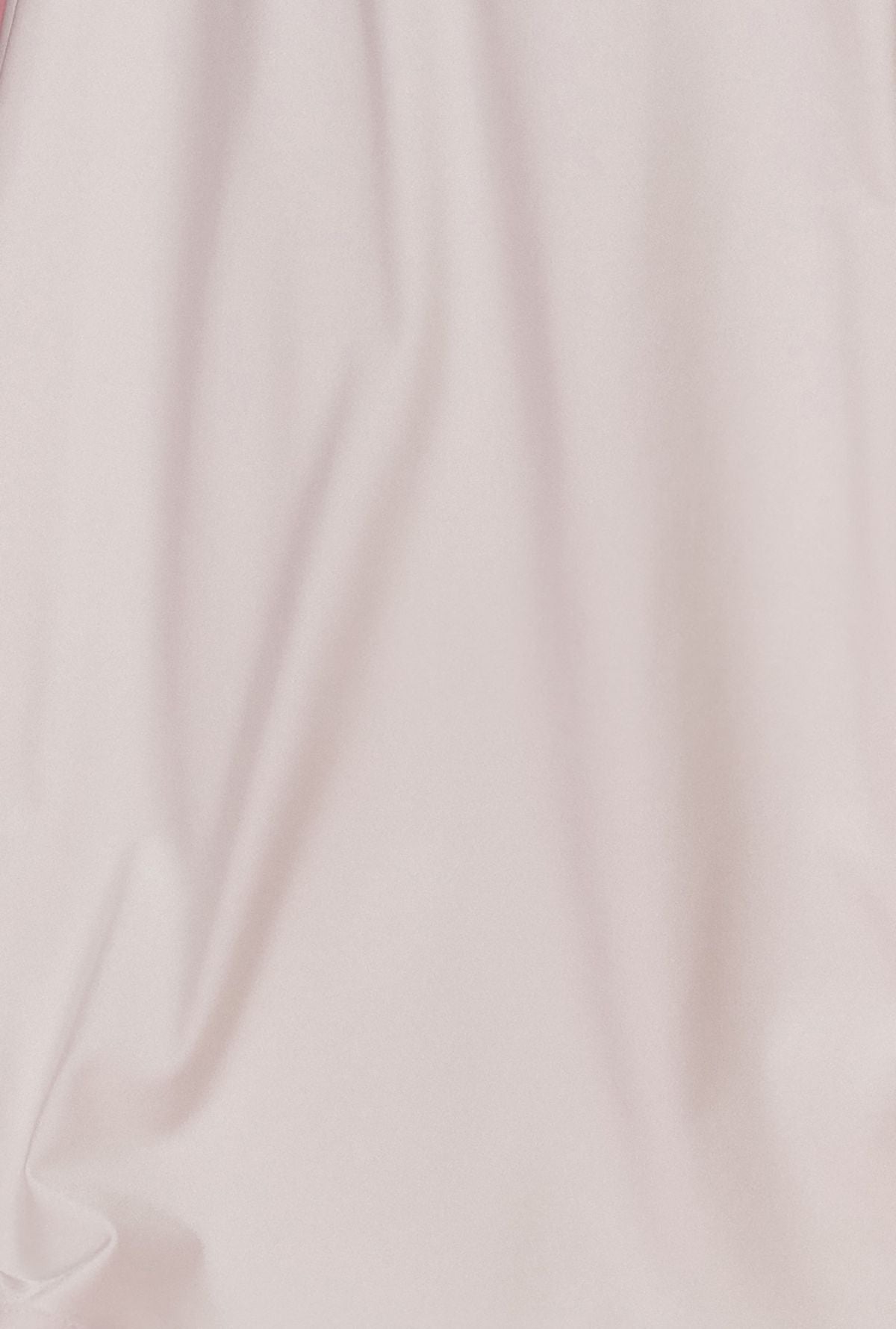White gown fabric with smooth drape and stitched seam detail