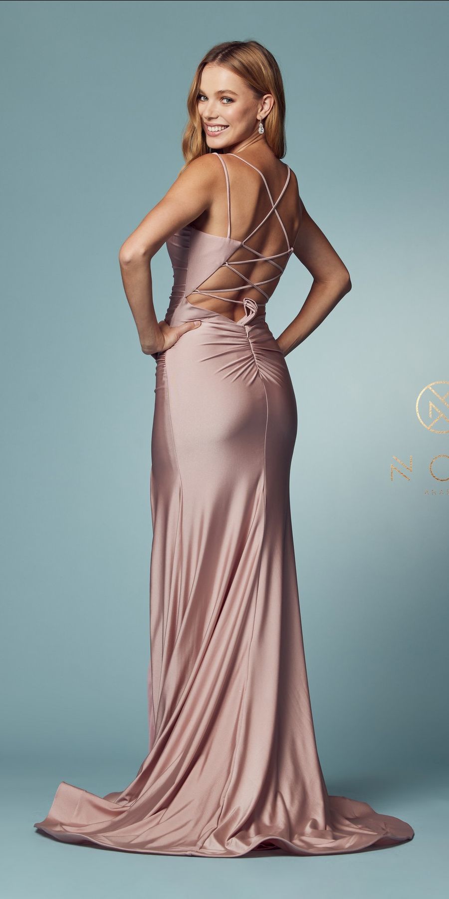 Dusty rose long fitted gown with crisscross spaghetti straps and side slit