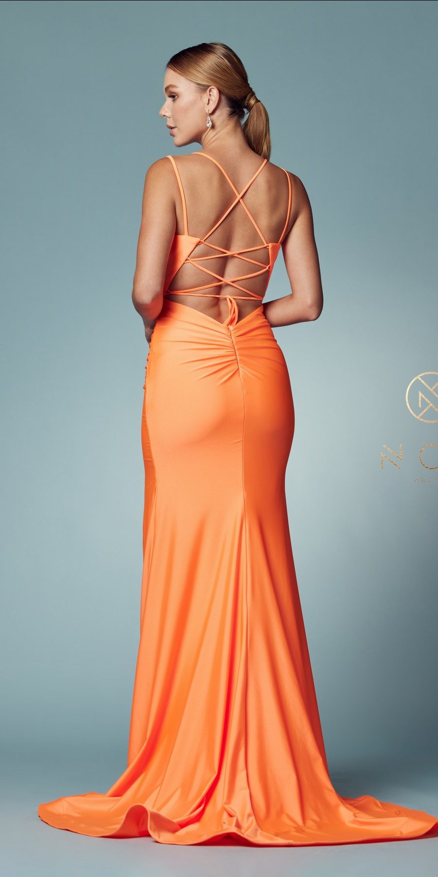 Orange fitted gown back view with crisscross spaghetti straps and side slit