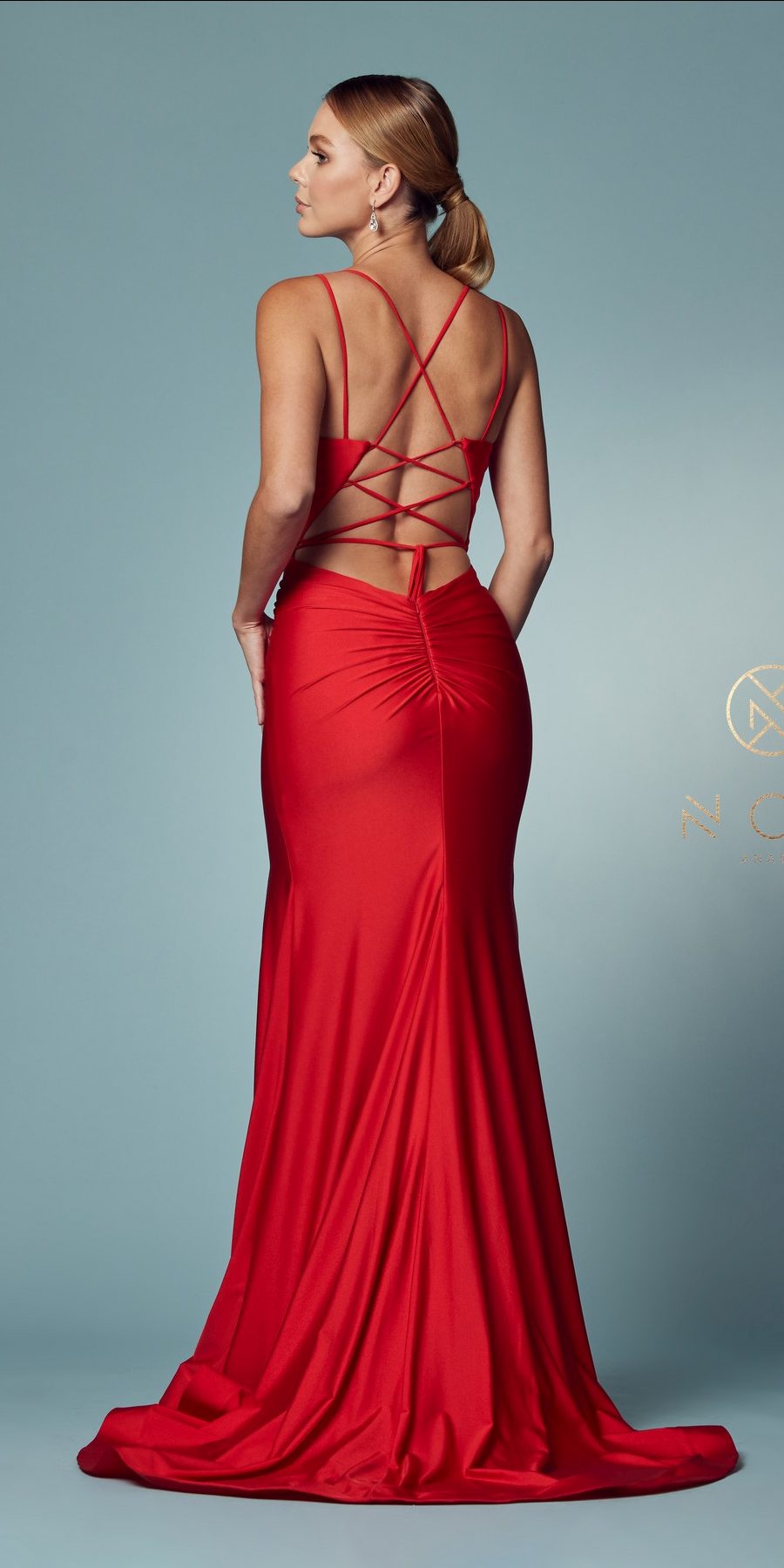Red long fitted gown with back crisscross straps, spaghetti straps, and front slit