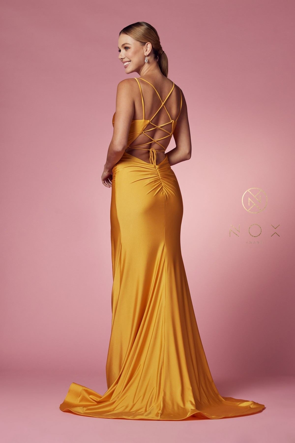 Yellow fitted gown back view with crisscross spaghetti straps and side slit