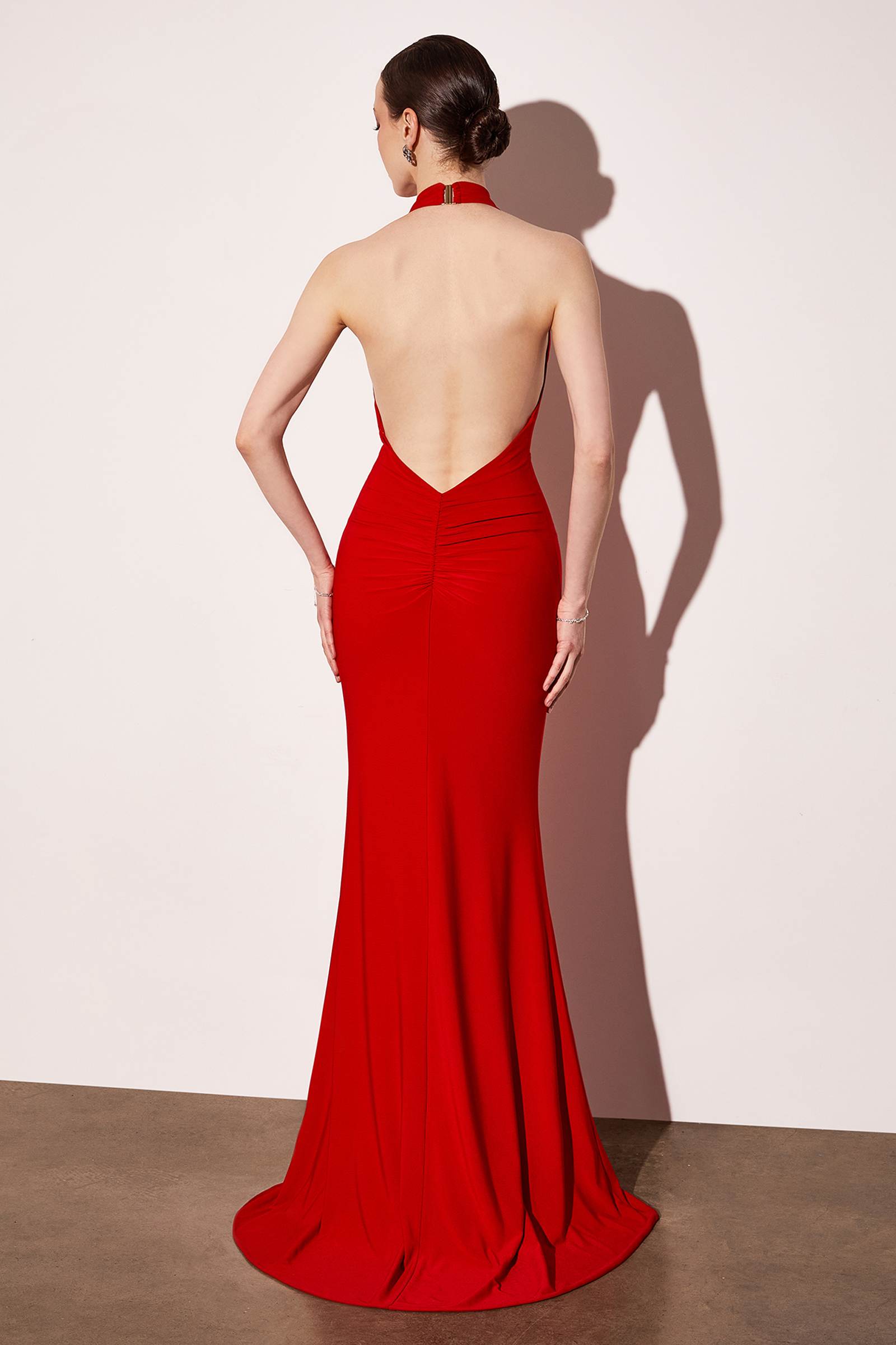Red long halter open-back evening gown with V-neck and mermaid skirt