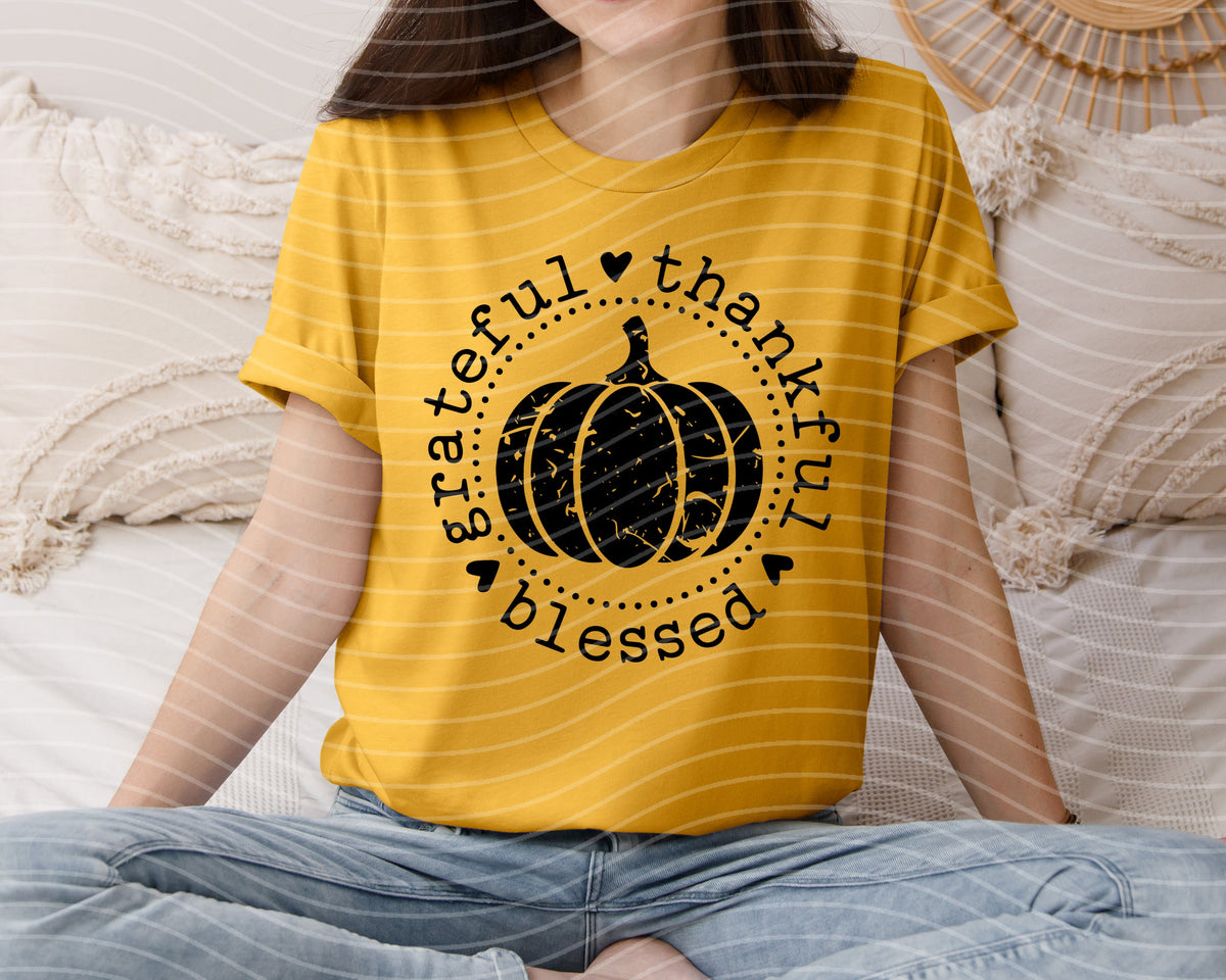 Mustard yellow graphic tee with black pumpkin and 'grateful thankful blessed' text