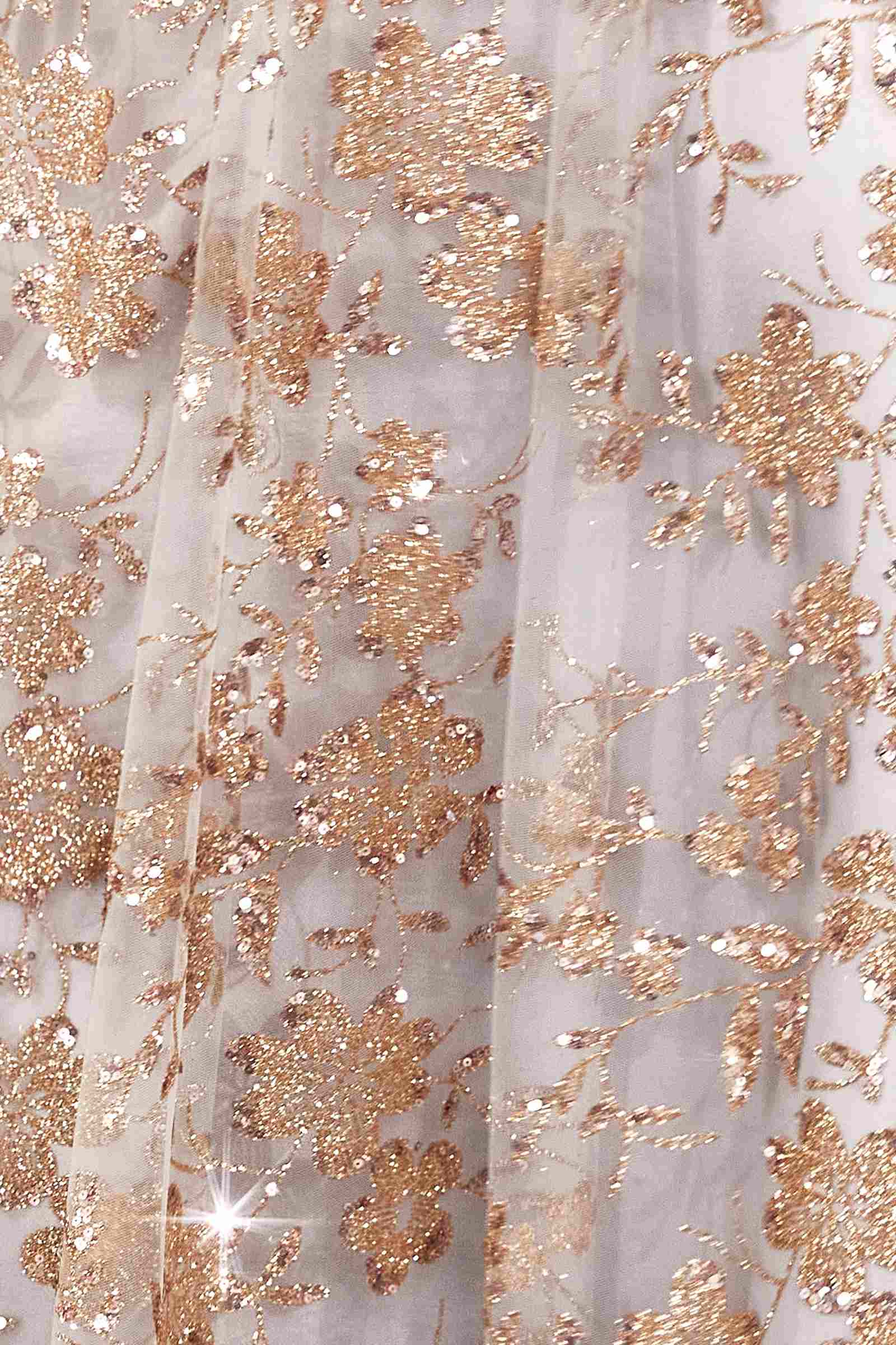 Gold glitter floral embroidery on a light base fabric, forming a dense all-over pattern.