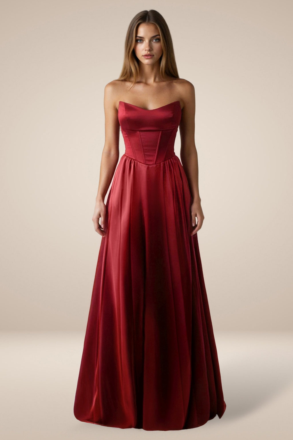 Burgundy strapless satin A-line gown with fitted corset-style bodice and pleats