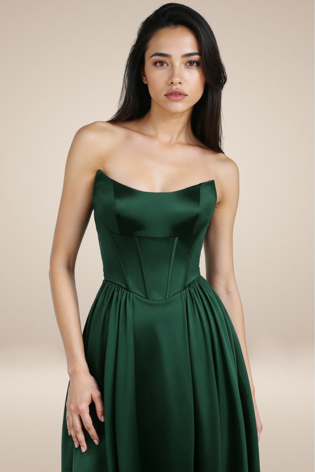 Dark green satin A-line strapless gown with corset-style bodice and pleats