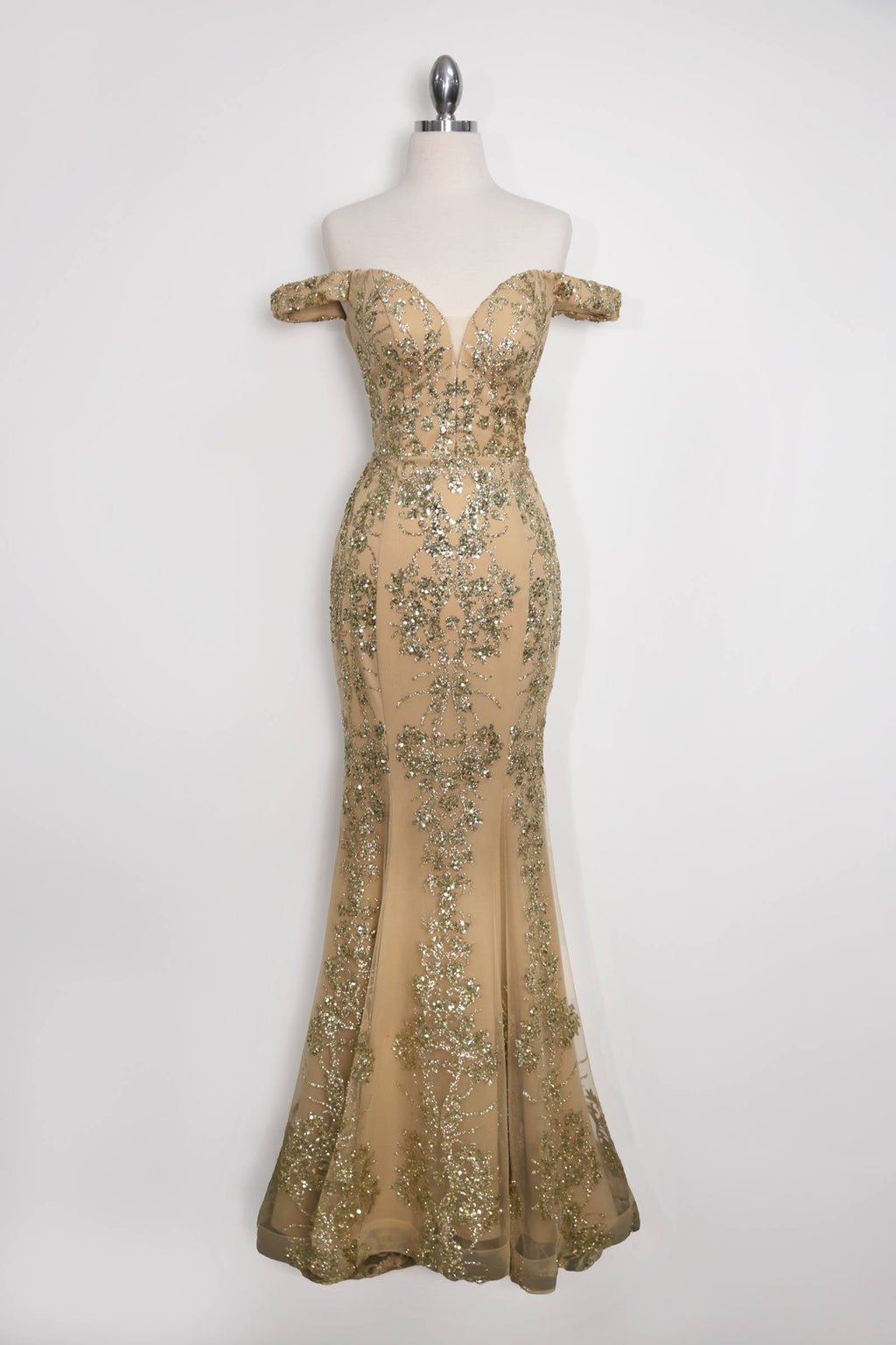 Gold sequin lace fitted gown on mannequin with flowing mermaid skirt