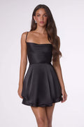 Black satin mini dress with thin straps and flared skirt