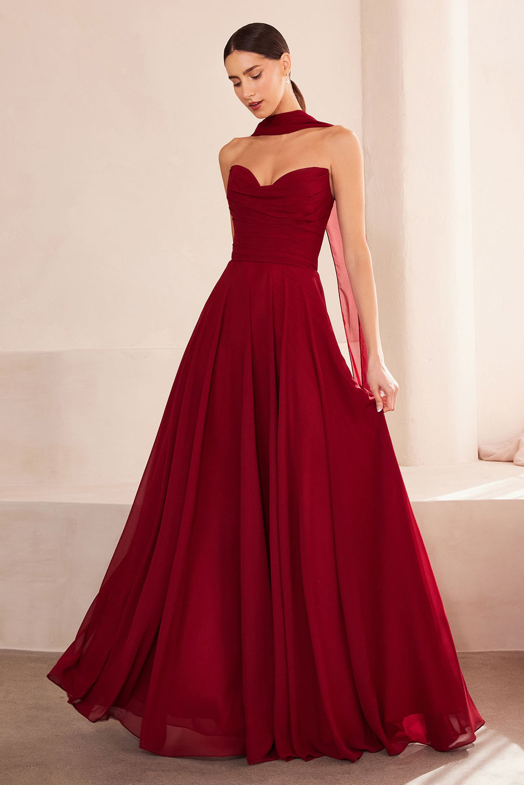 Strapless A-line bridesmaid dress in burgundy with fitted bodice and pleated skirt