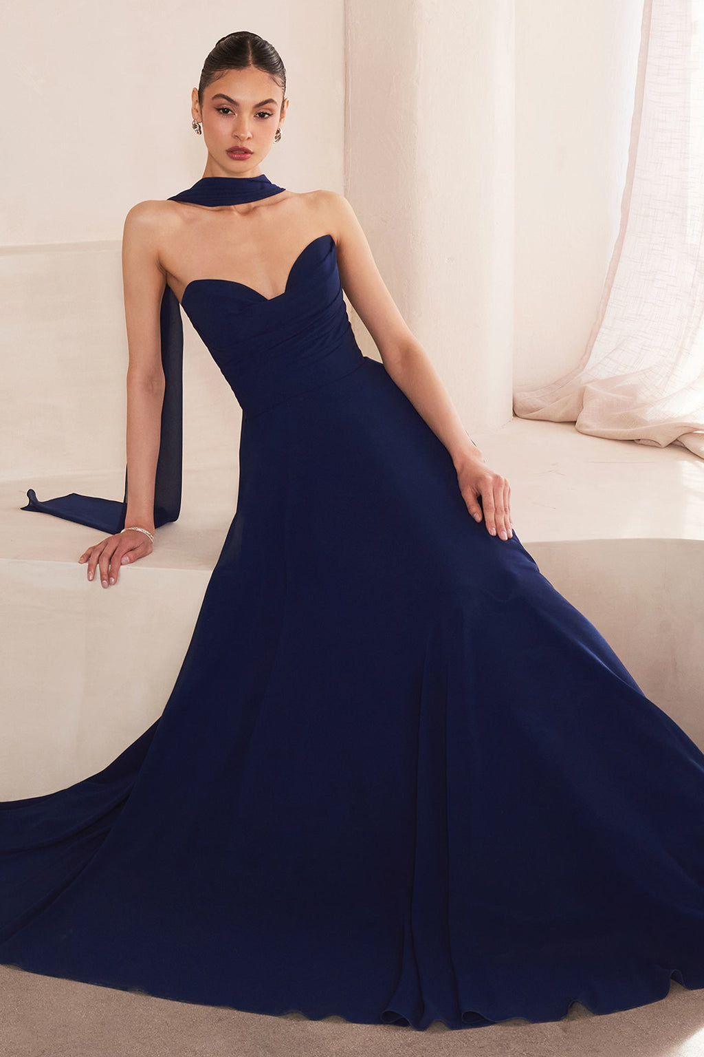 Navy blue strapless bridesmaid gown, flowing A-line skirt and sweetheart neckline