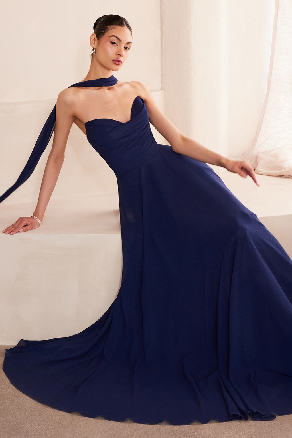 Navy blue strapless A-line bridesmaid gown with sweetheart neckline and draped skirt