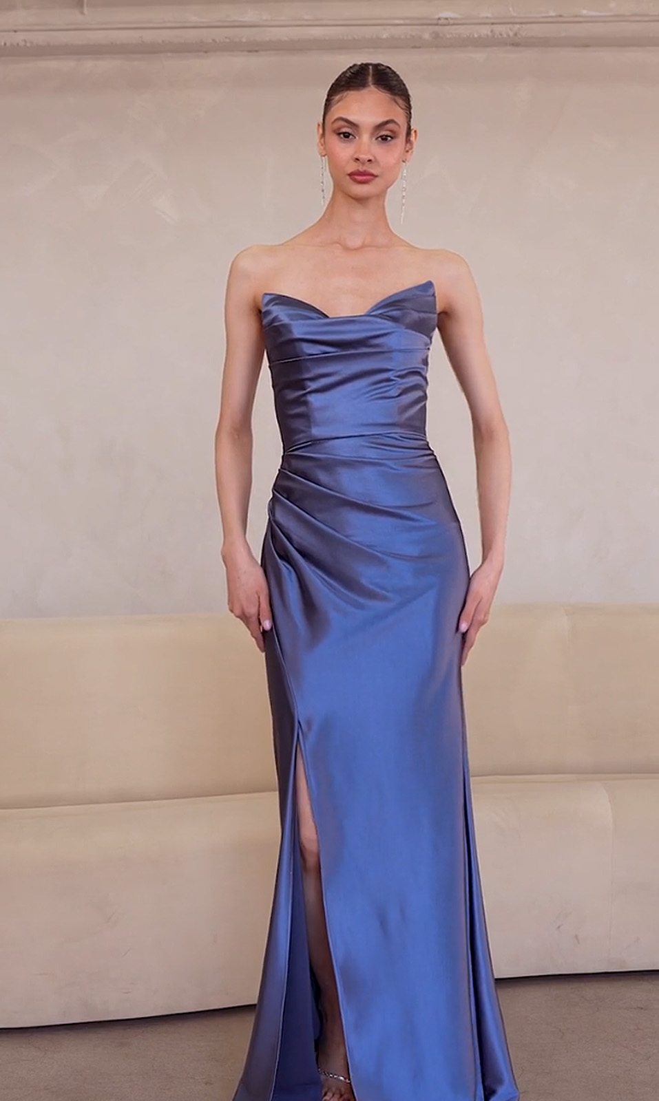 Off-the-shoulder fitted satin gown in deep blue with draped bodice and high front slit