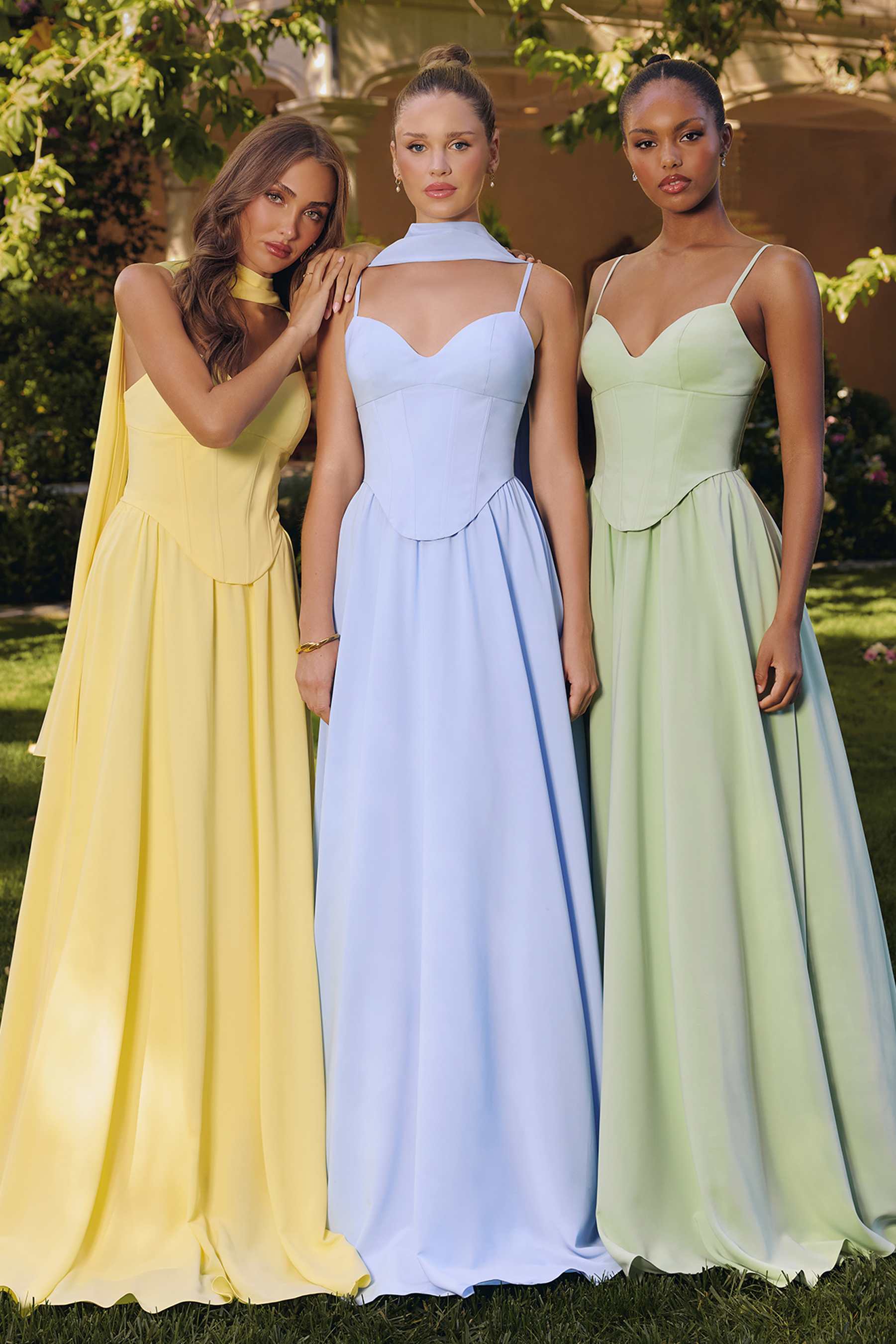Three chiffon A-line long dresses in yellow, light blue, and sage green