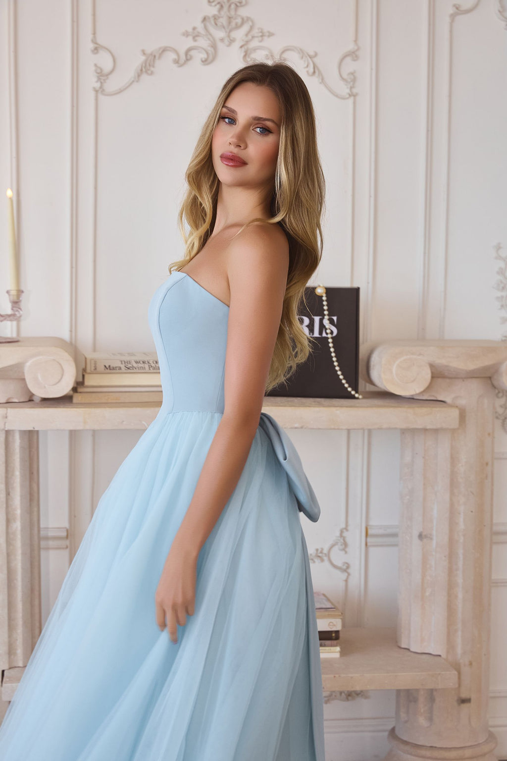 Light blue strapless A-line tulle gown with fitted bodice and layered skirt
