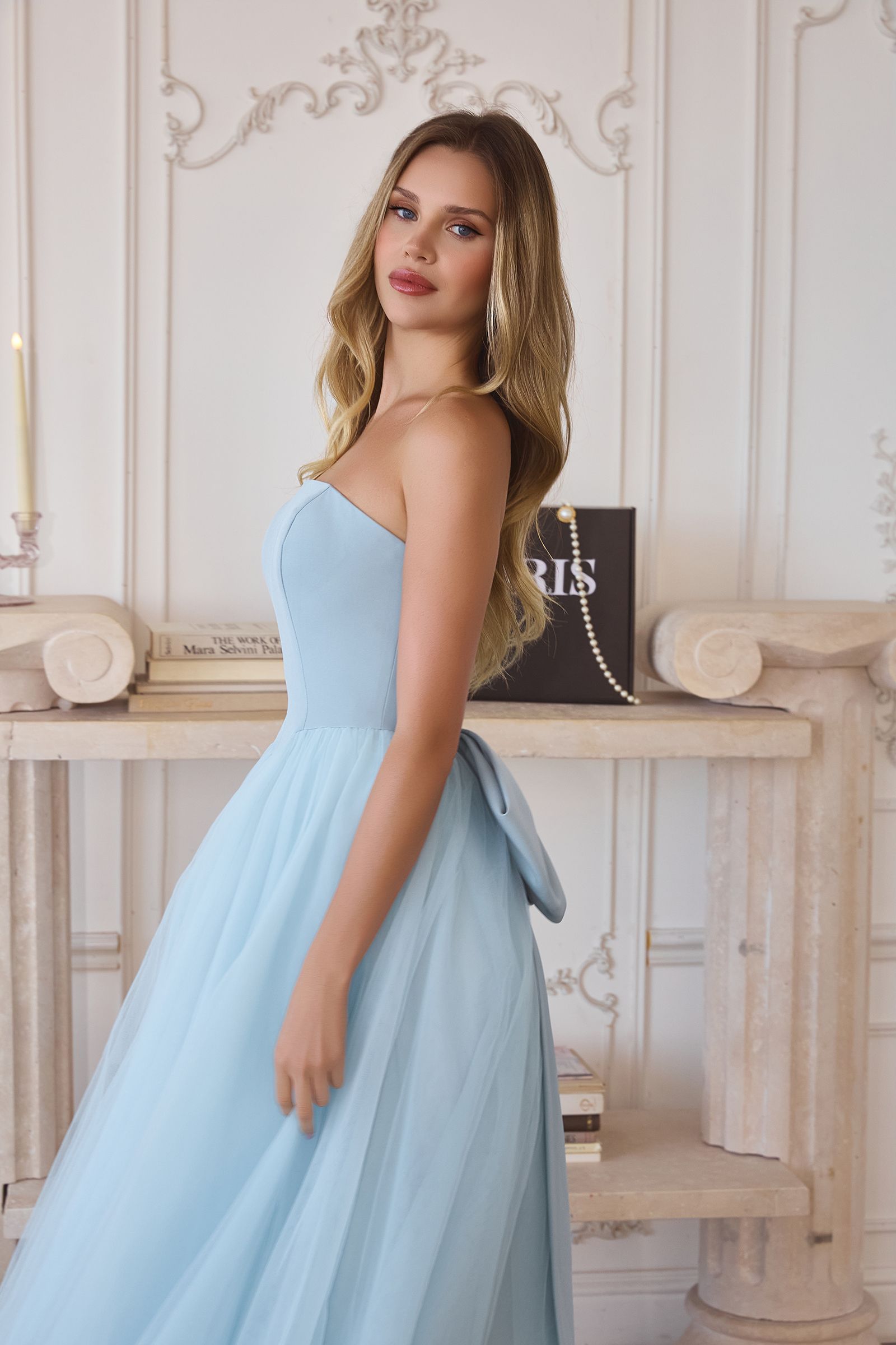 Light blue strapless A-line tulle gown with fitted bodice and layered skirt