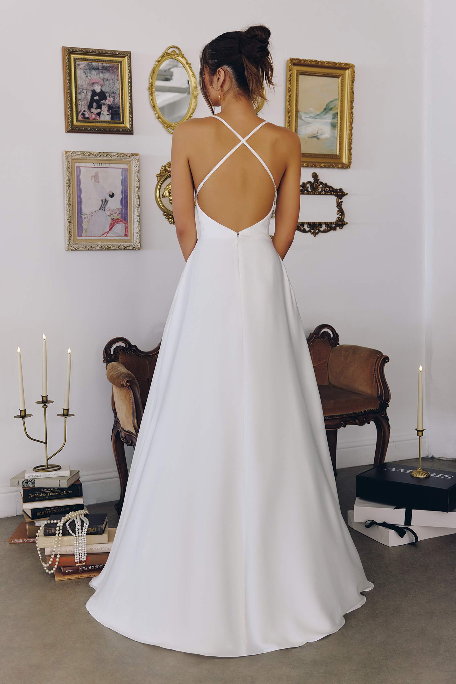 Off-white wedding dress with crisscross open back and spaghetti straps