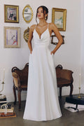 Off-white A-line wedding dress with spaghetti straps and V-neck bodice