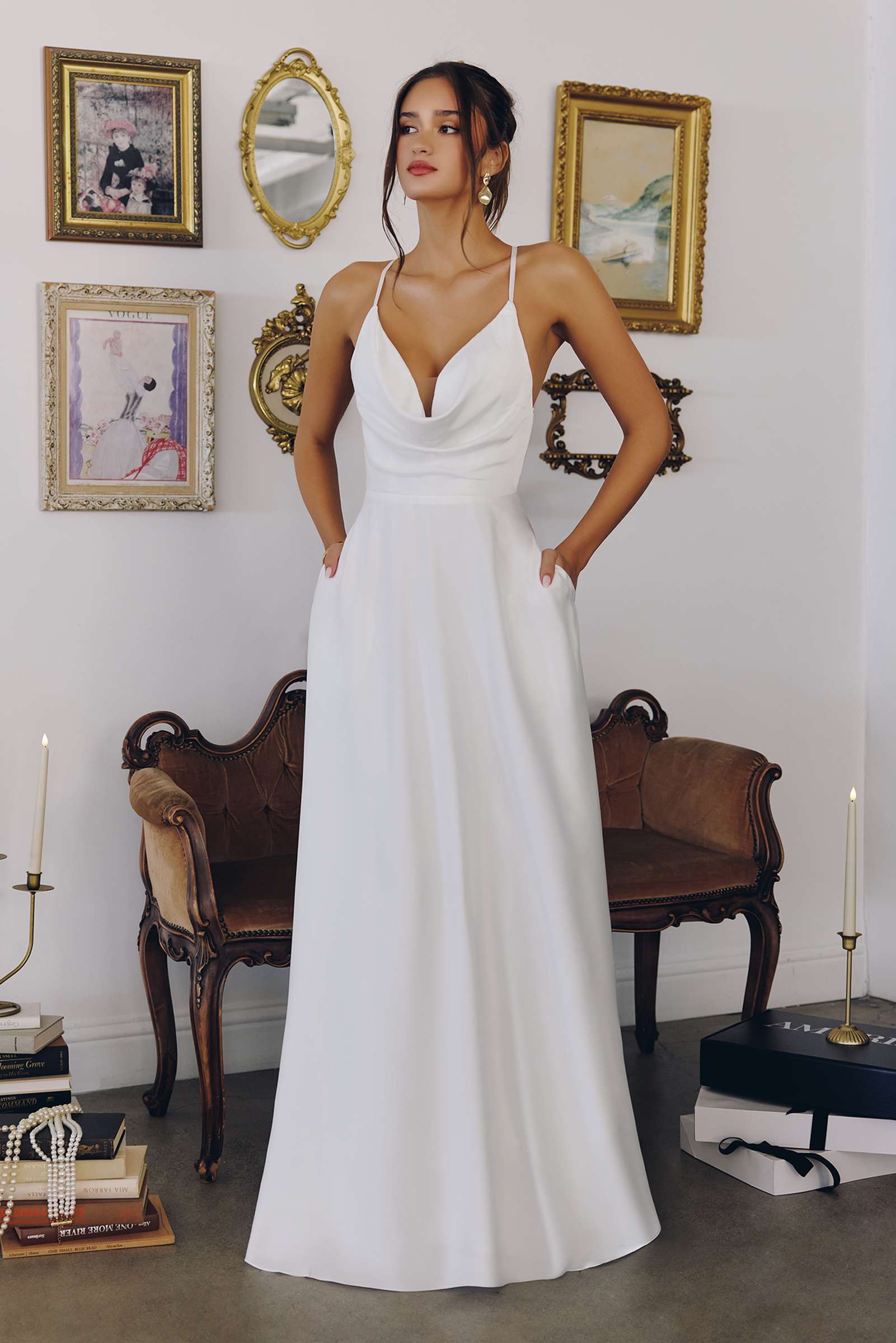 Off-white A-line wedding dress with spaghetti straps and V-neck bodice