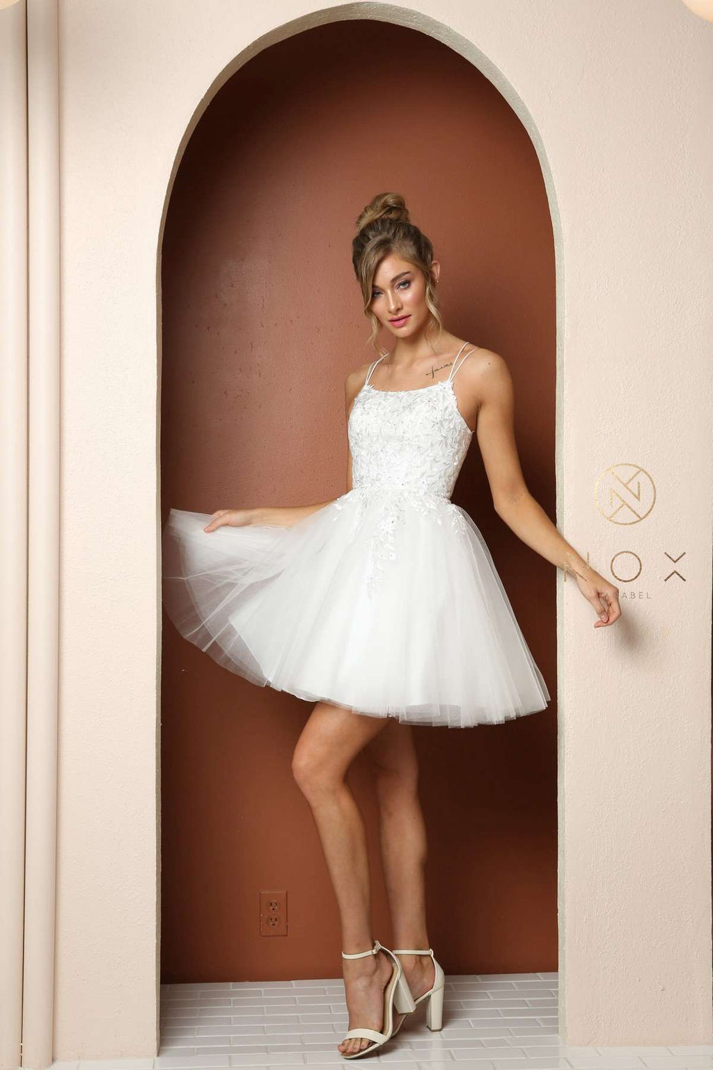 White baby doll dress with corset back, lace-up straps, A-line tulle skirt