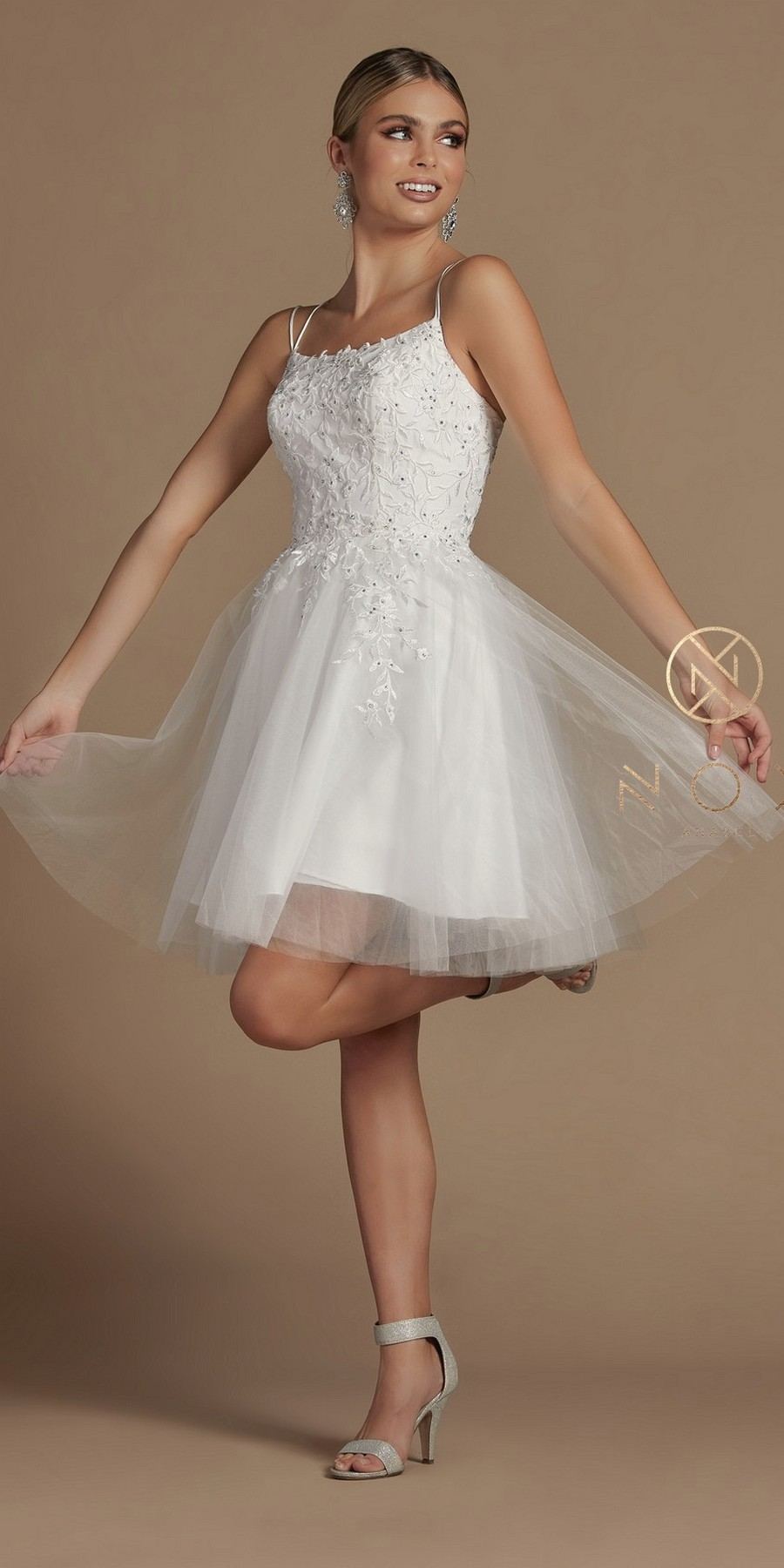 White A-line baby doll dress with corset back bodice and tulle skirt