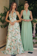 Floral A-line gown with plunging neckline, sleeveless; light base with green and pink blooms