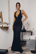 Black halter satin floor-length gown with deep V neckline and fitted ruched bodice