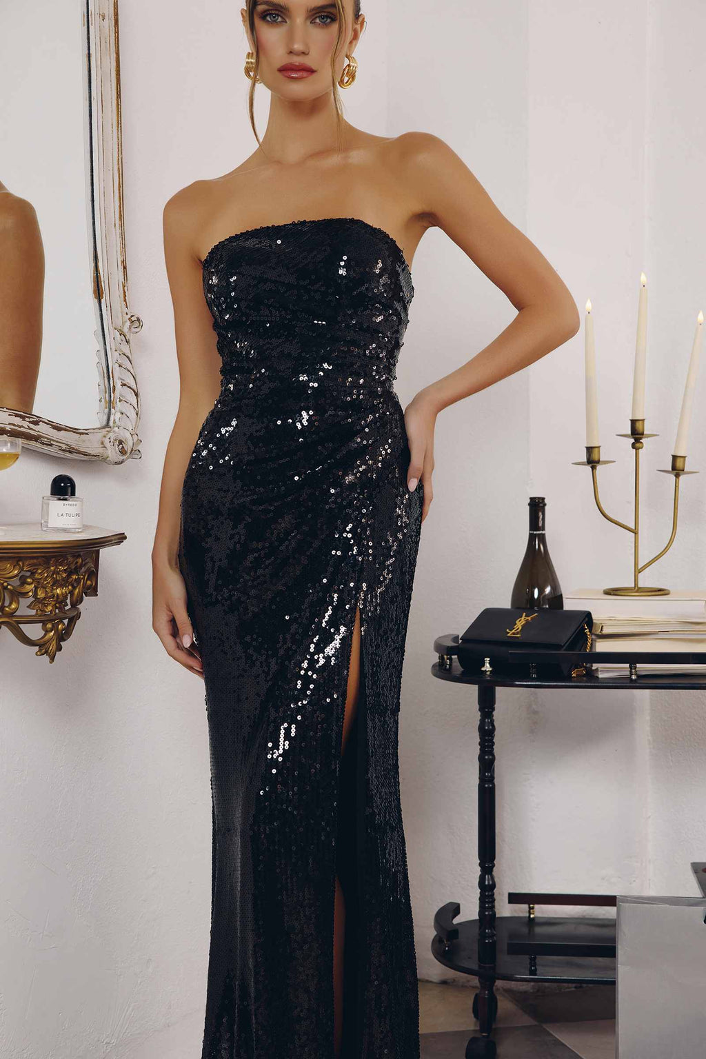 Black strapless sequin fitted gown with side thigh slit and sparkling allover shimmer