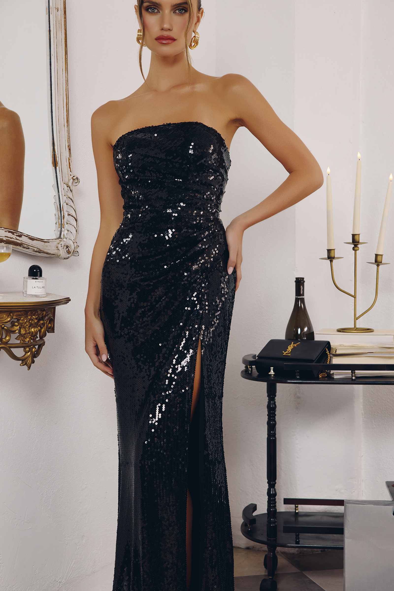 Black strapless sequin fitted gown with side thigh slit and sparkling allover shimmer
