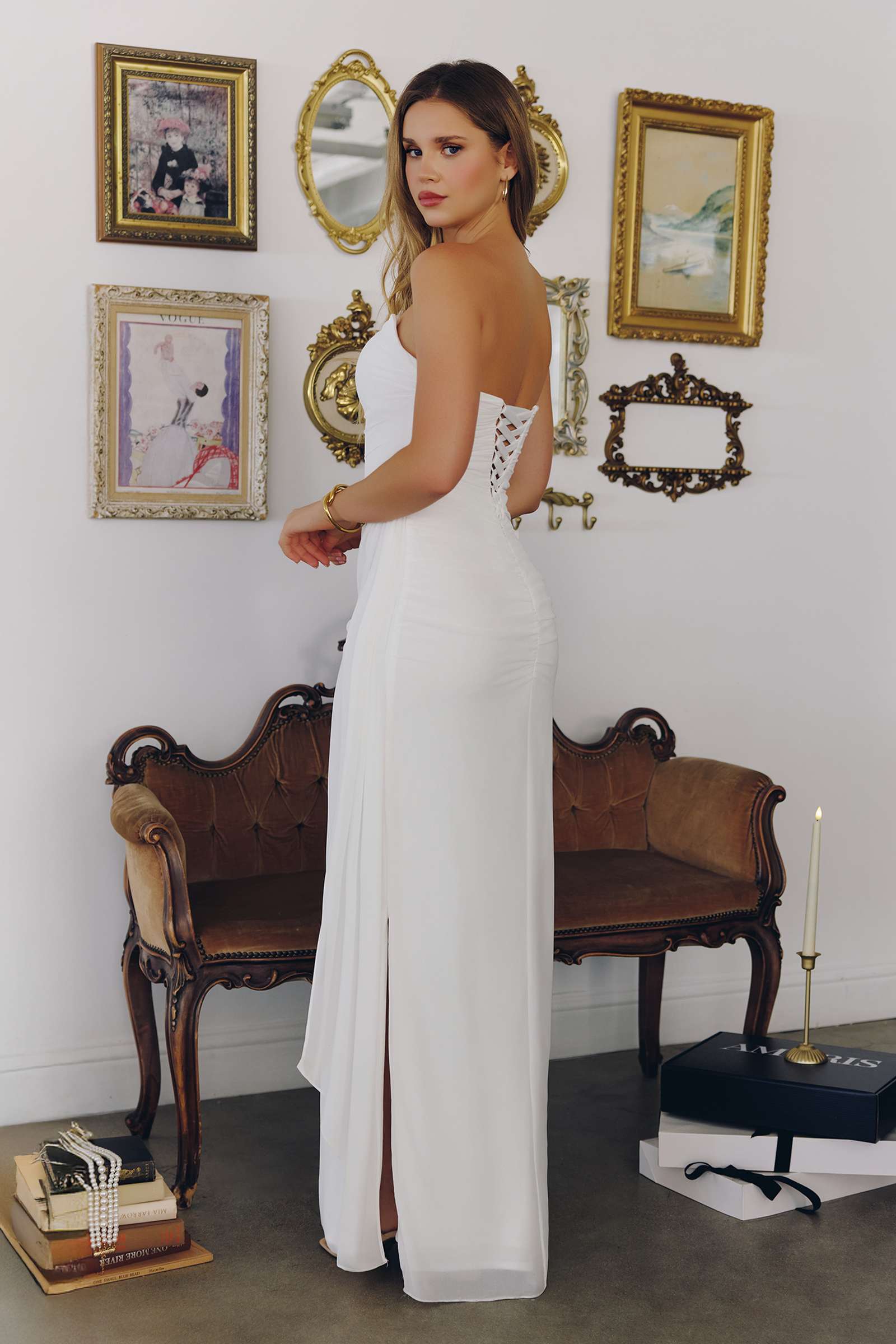 Off-white strapless bridal gown with side sash, sleeveless column silhouette