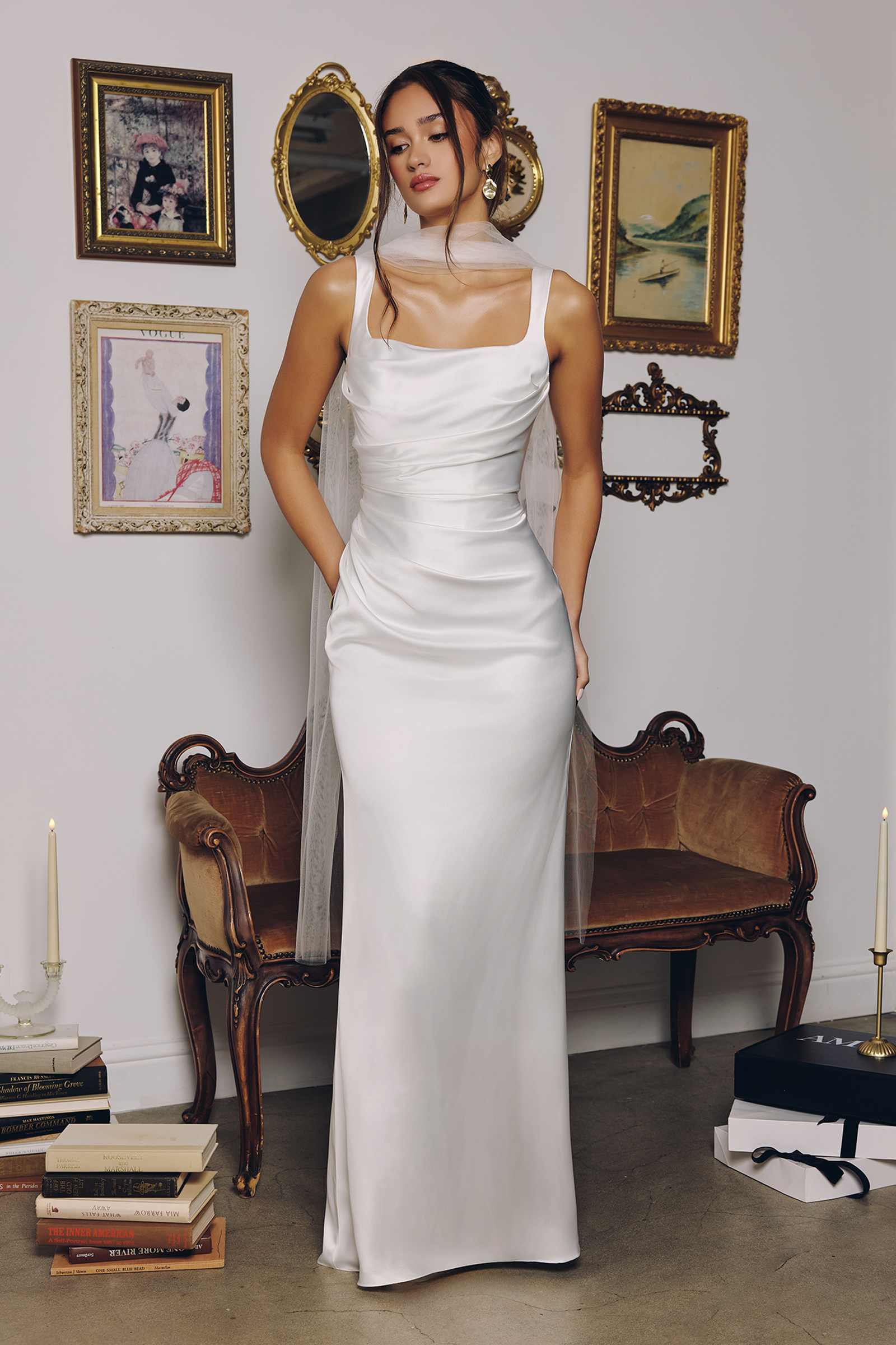 Off-white satin fitted gown with thin straps, ruched waist and long column silhouette