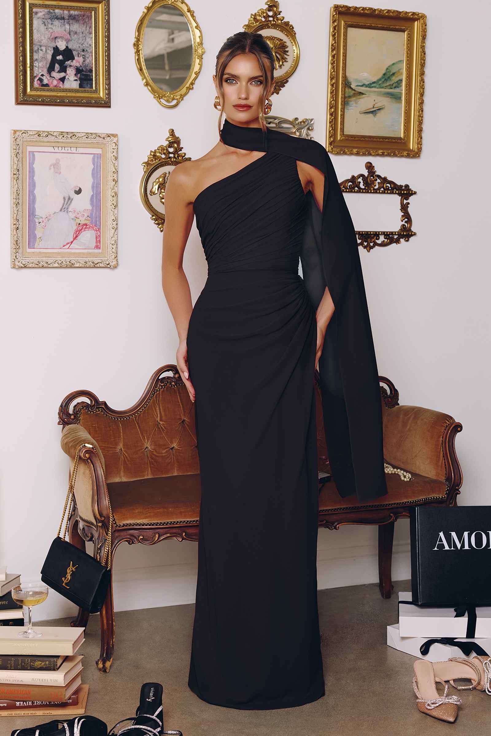 Black one-shoulder chiffon formal gown with draped one-side bodice and long skirt.